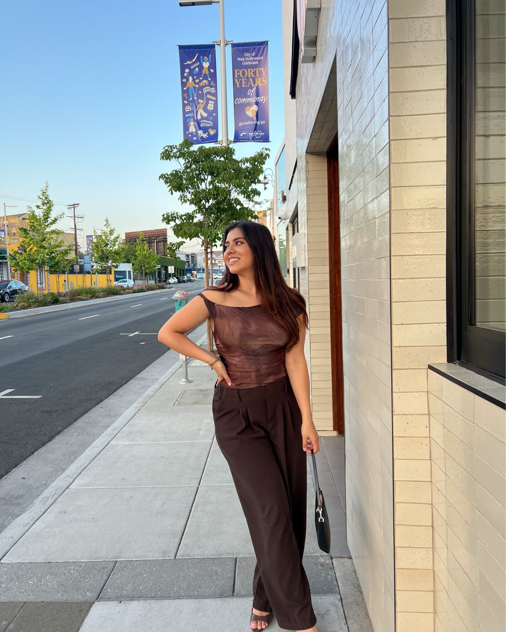 This sheer brown mesh top paired with tailored high-waisted trousers is effortless evening chic. I styled it with strappy heels and a mini shoulder bag for a sleek, minimal look. Shop this neutral night-out outfit on my LTK—perfect for drinks, dinner, or city strolls. #dinneroutfit #nightout #chic

#LTKWorkwear