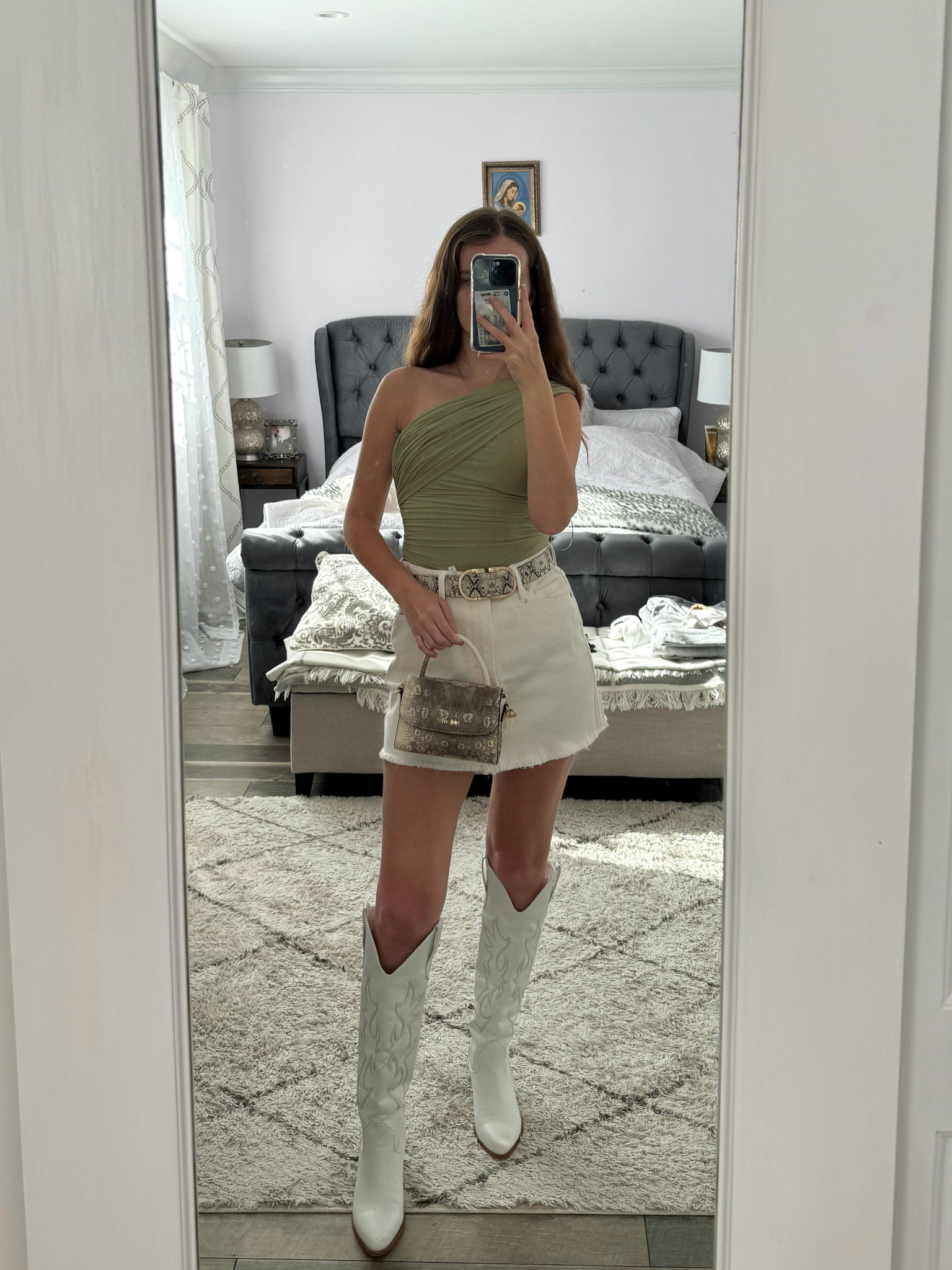 A white denim skirt paired with an asymmetrical top, white cowboy boots, and a snake print top handle bag makes a great spring or country concert outfit. 
.
.
.
.
.
.
Spring outfits | spring tops | spring shoes | skirt outfits | Nashville outfits | skirt and boots | denim skirt outfit  | mini denim skirt | jean skirt outfit | mini jean skirt | white jean skirt | white skirt | high waisted skirt | cute tops | summer tops | one shoulder top | dressy tops | cute tops | date night outfit | date night tops | boots outfit | western boots | cowboy boots outfit | white cowboy boots | mini bags | handbags | designer bags | outfit inspo | outfit ideas | 

#LTKFestival #LTKGiftGuide #LTKSeasonal #LTKFind #LTKunder50 #LTKunder100 #LTKU #LTKsalealert #LTKfindsunder50 #LTKfindsunder100 #LTKstyletip #LTKworkwear #LTKtravel #LTKshoecrush #LTKitbag #LTKparties