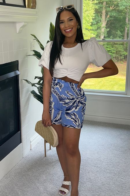 Resort style or vacation outfit. White cropped top with puffer sleeves and high waisted printed shorts. Shorts on sale under $10! 
Original top is ZARA from last season, tagging similars  

#LTKtravel #LTKunder50 #LTKsalealert