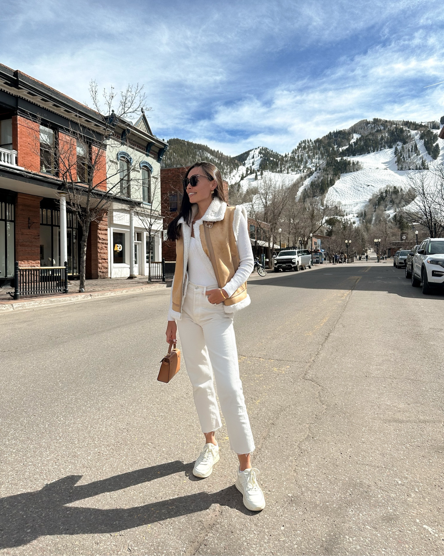 Kat Jamieson wears jeans, a shearling vest and bodysuit in Aspen. What to wear in Aspen, spring outfit, winter outfit, sneakers, denim. 

#LTKshoecrush #LTKSeasonal #LTKtravel