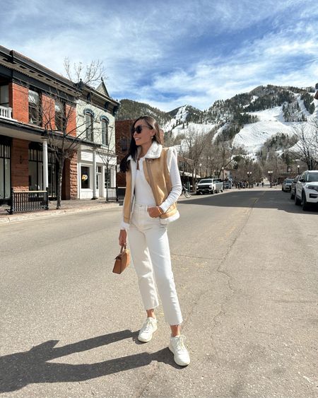 Kat Jamieson wears jeans, a shearling vest and bodysuit in Aspen. What to wear in Aspen, spring outfit, winter outfit, sneakers, denim. 

#LTKshoecrush #LTKSeasonal #LTKtravel
