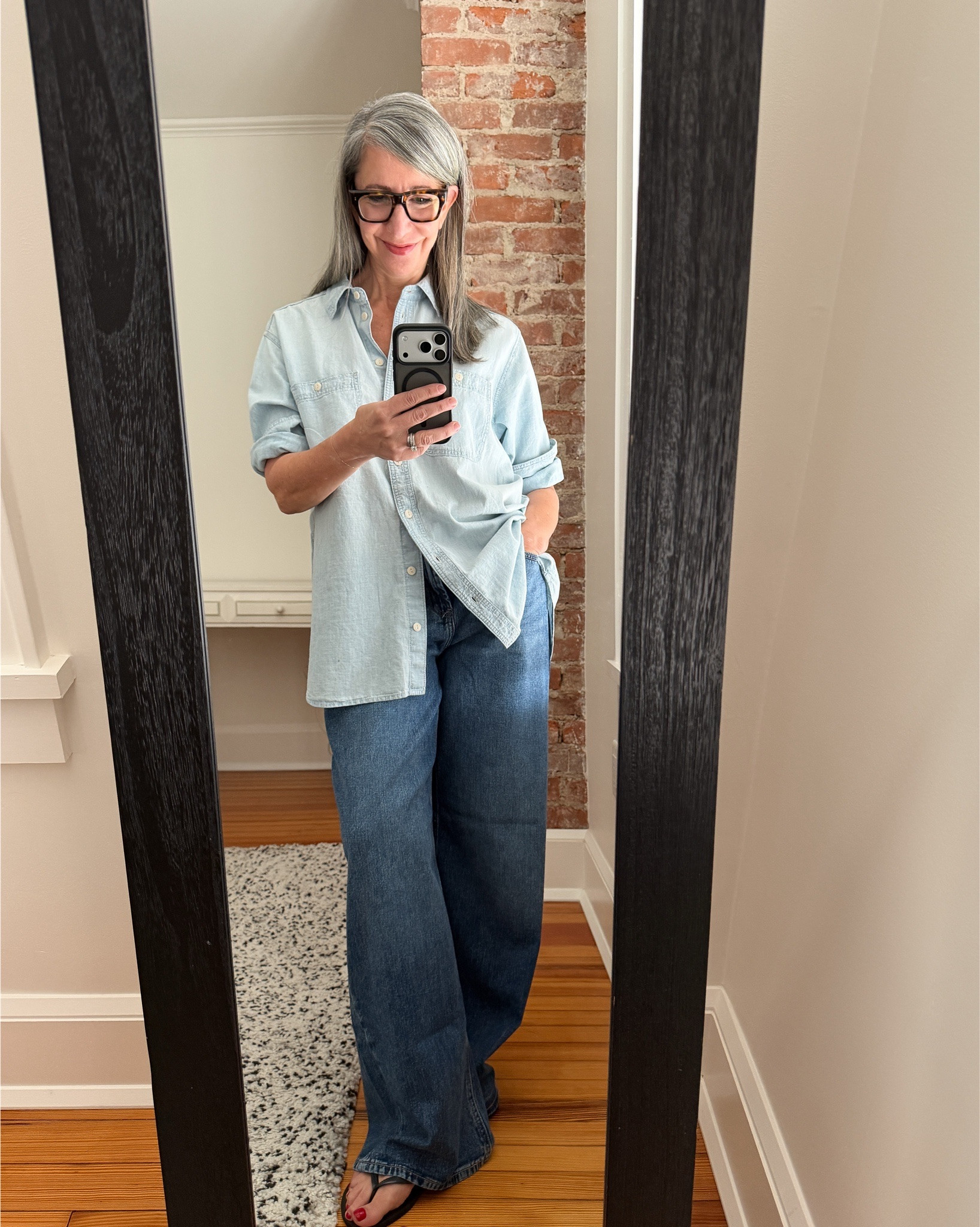 #ComfortableGirlWinter - the denim shirt upgrade

The oversized denim button-up is a classic - but many of us have been
styling it the same way for years.

Fully buttoned.
Over leggings.
Flats.
A quick sleeve roll.

It works... but it's a bit "2010s". A few small shifts make it feel more up to date and effortlessly stylish: swap the leggings for loose jeans, add flip flops for an unexpected shoe, button just the middle few buttons, and do a more intentional sleeve roll (fold the sleeve up toward the elbow first, then turn the fold up twice).

Same shirt.
Completely different energy.

Swipe to see the "before."
.
.
.
.
#Over60Style #StyleOver60 #EverydayStyle #ModernStyle #WearWhatYouOwn
