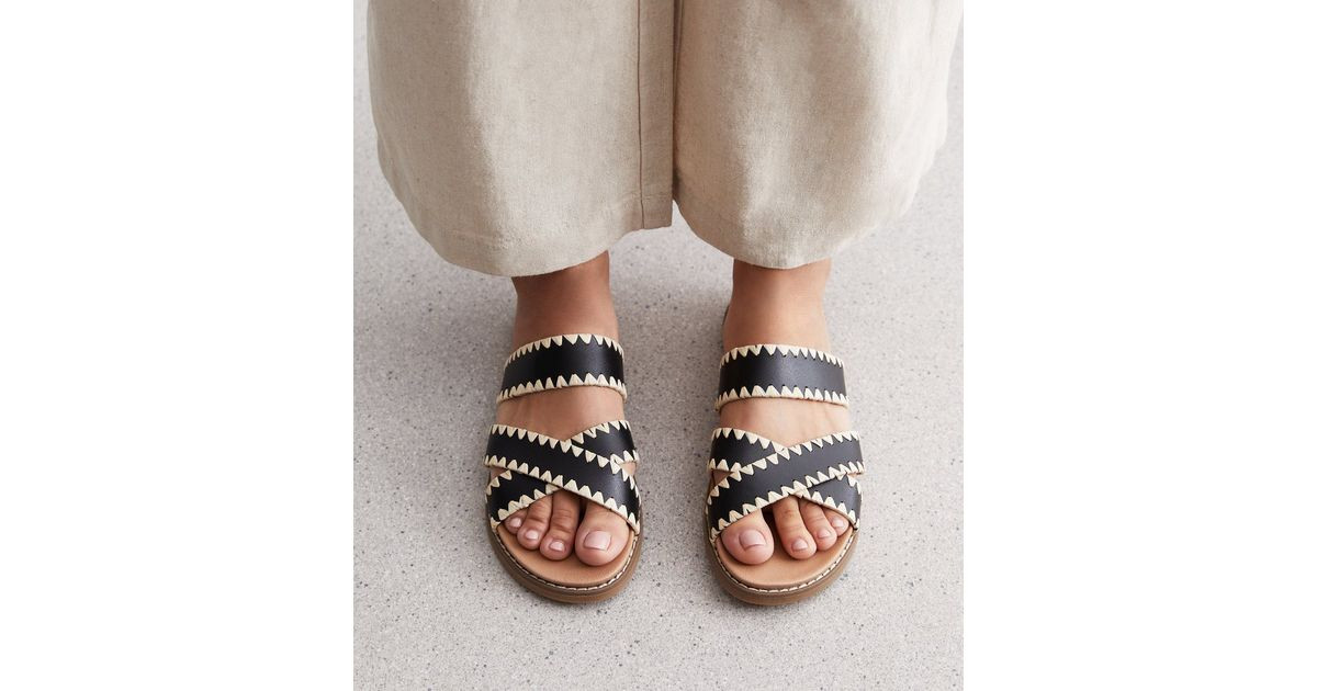 Black Leather-Look Whipstitch Cross Over Sliders
						
						Add to Saved Items
						Remove fro... | New Look (UK)