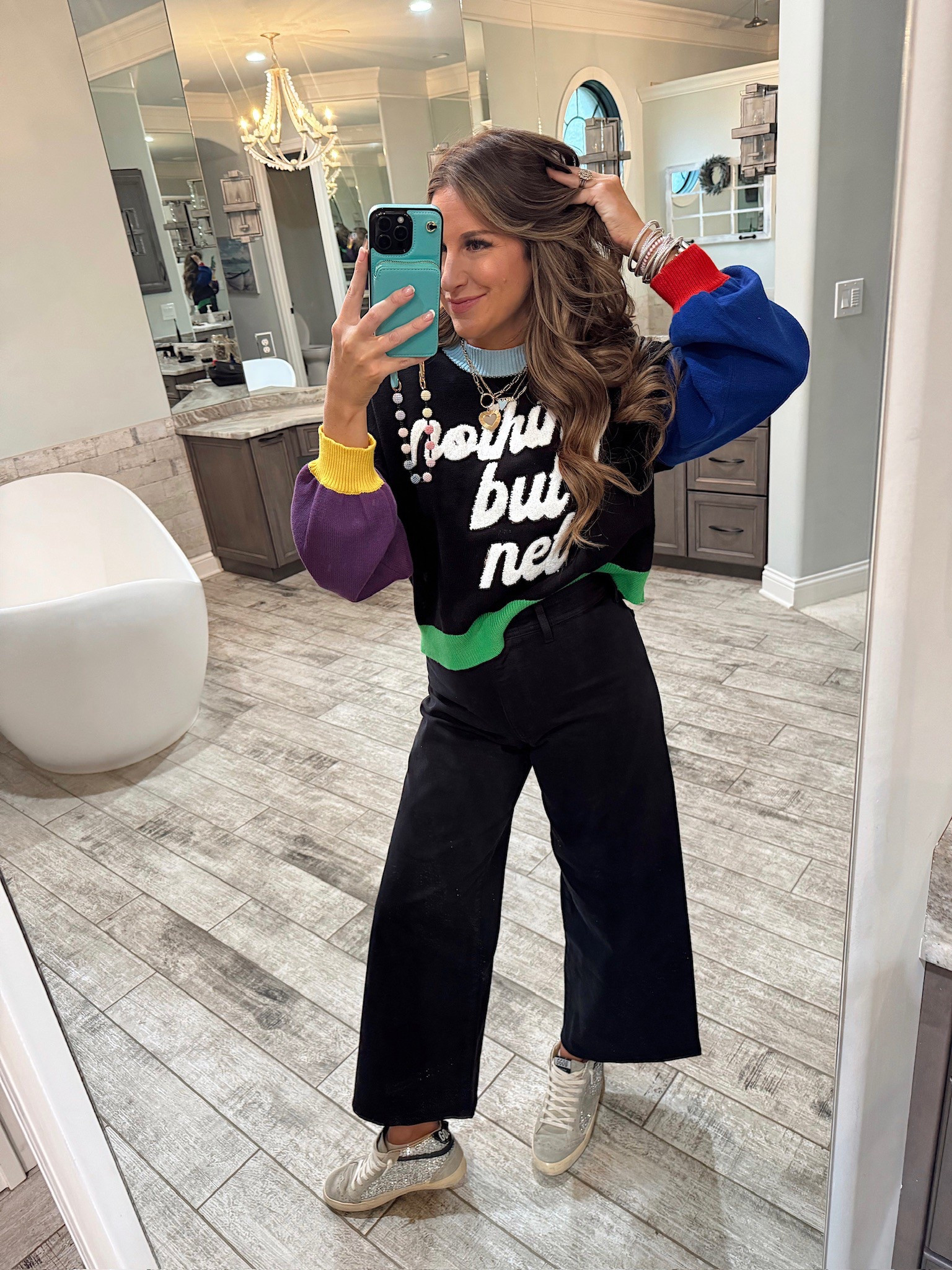 In a medium queen of sparkles nothing but net sweater, size 6 target wide leg cropped jeans, sequin sneakers and accessories for March Madness - all fits tts.

#LTKSeasonal #LTKStyleTip #LTKShoeCrush