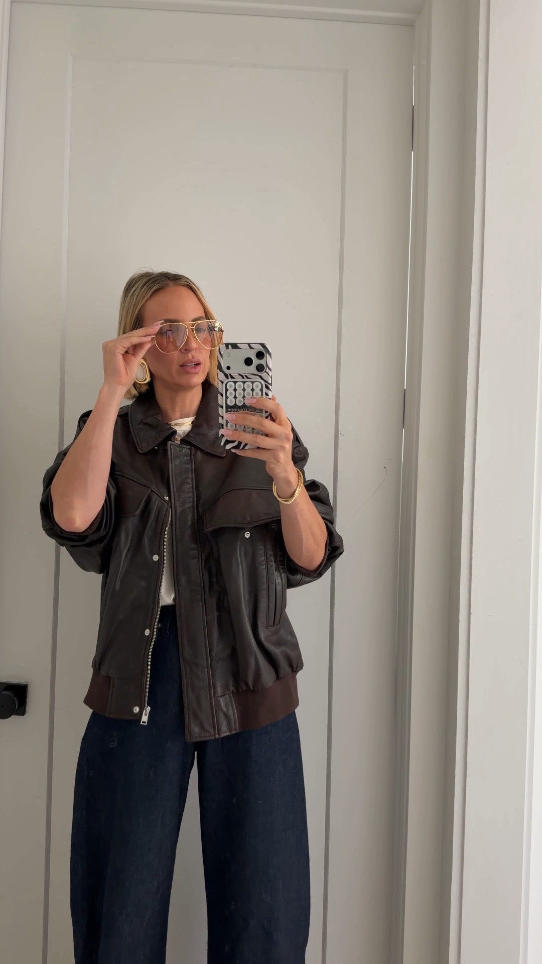 Wearing a medium in the leather jacket. A small in the silk top. My usual size in the jeans but if in between sizes definitely size up. Tall girl friendly! I’m 5’10. ￼heels run slightly big. If in between sizes, size down. 

@LAMARQUE

#LTKOver40 #LTKdayinmylife #LTKSeasonal