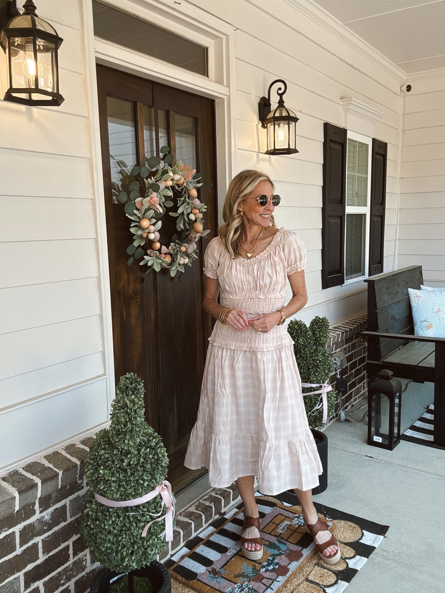 Embrace the charm of this $30 smocked dress. This flattering dress offers a form fitting silhouette that flows gracefully into a tiered skirt with a gentle flare comes in seven colors, wearing a size extra small.