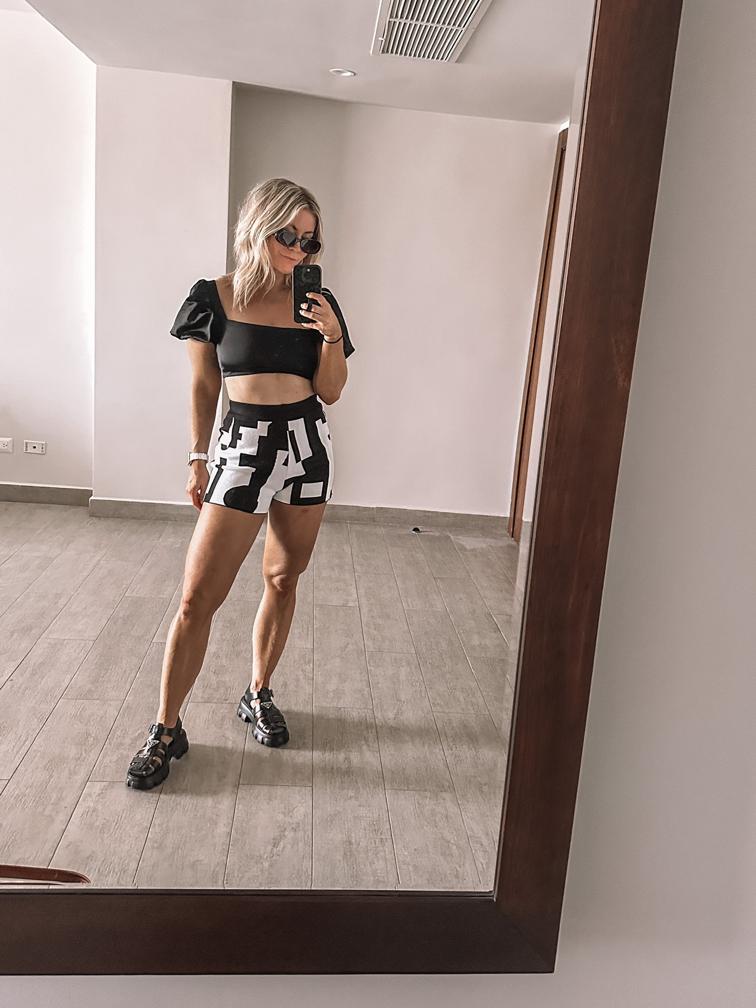 Black puff sleeve bandeau bikini top, black and white patterned shorts, Prada lug monolith fisherman sandals, resort look, vacation outfit inspo, summer dressing, swimwear 

#LTKshoecrush #LTKswim #LTKtravel