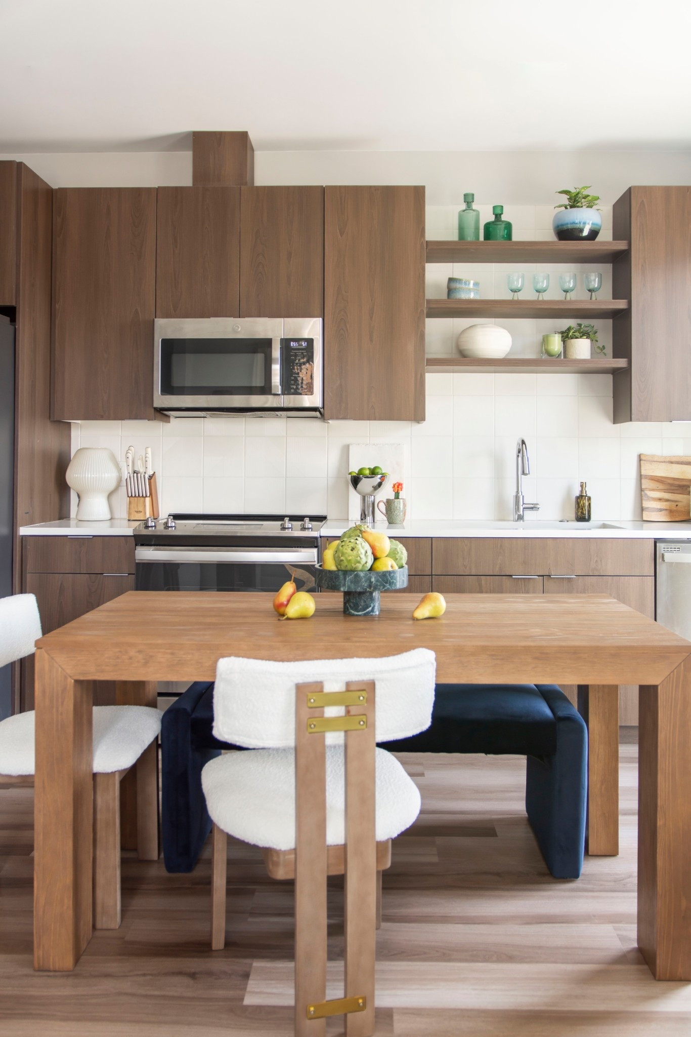 How to decorate an apartment kitchen with modern dining chairs, solid wood dining table, blue velvet dining bench, and stylish kitchen accessories 

#LTKStyleTip #LTKHome