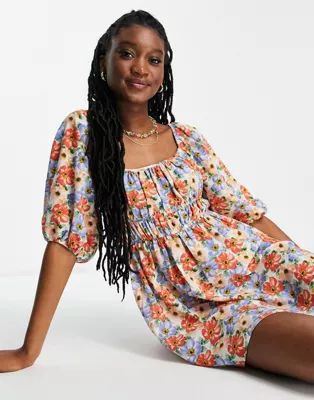 ASOS DESIGN ruched bust mini skater dress with puff sleeve in bold floral print | ASOS (Global)