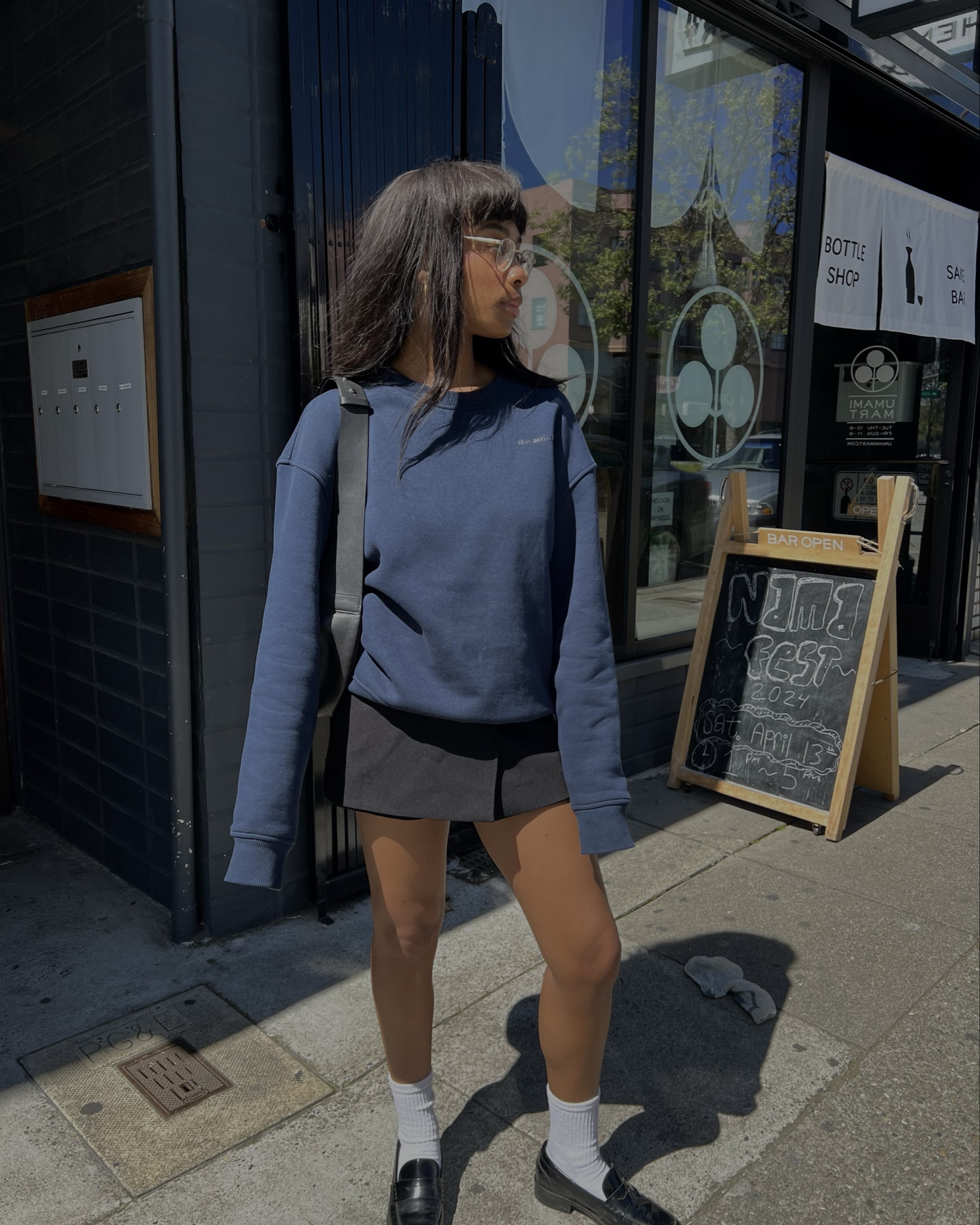 blue sweater, mini skirt, white socks, black loafers, black bag.

#LTKitbag #LTKstyletip