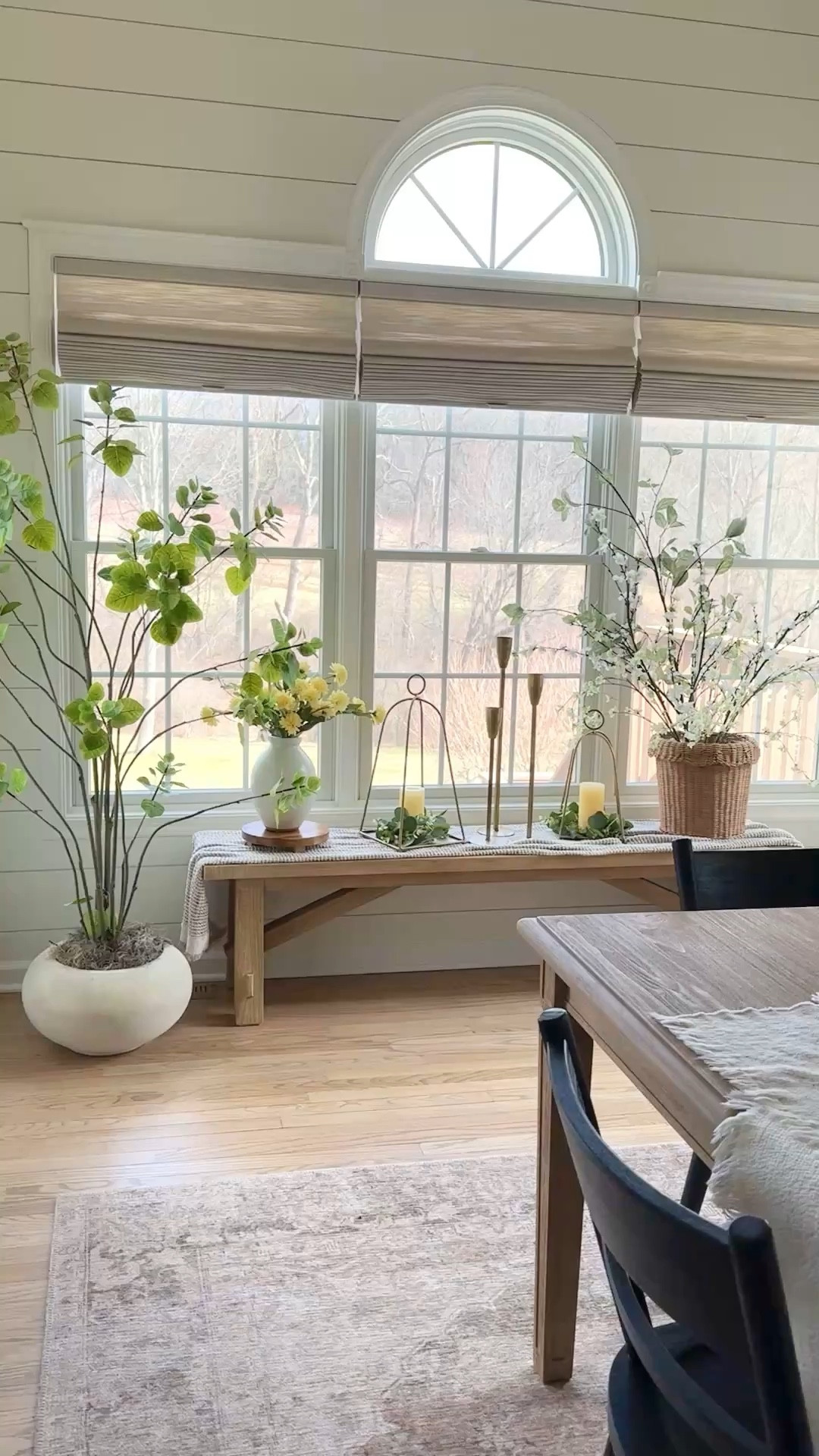 My favorite whimsical 6' coggygria tree. Planters, greenery, florals, similar candlesticks, area rug, dining chairs  