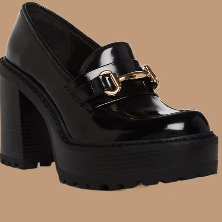 Trimmed in bit buckle hardware for a classic finish, the Kiera pumps by Madden Girl blend timeless loafer style with a fashion-forward lift.

3-1/2" block heel; 1-1/2" platform
Round-toe slip-on loafer pumps
Bit buckle hardware at vamp

Kiiera Platform Tailored Lug Sole Heeled Loafers