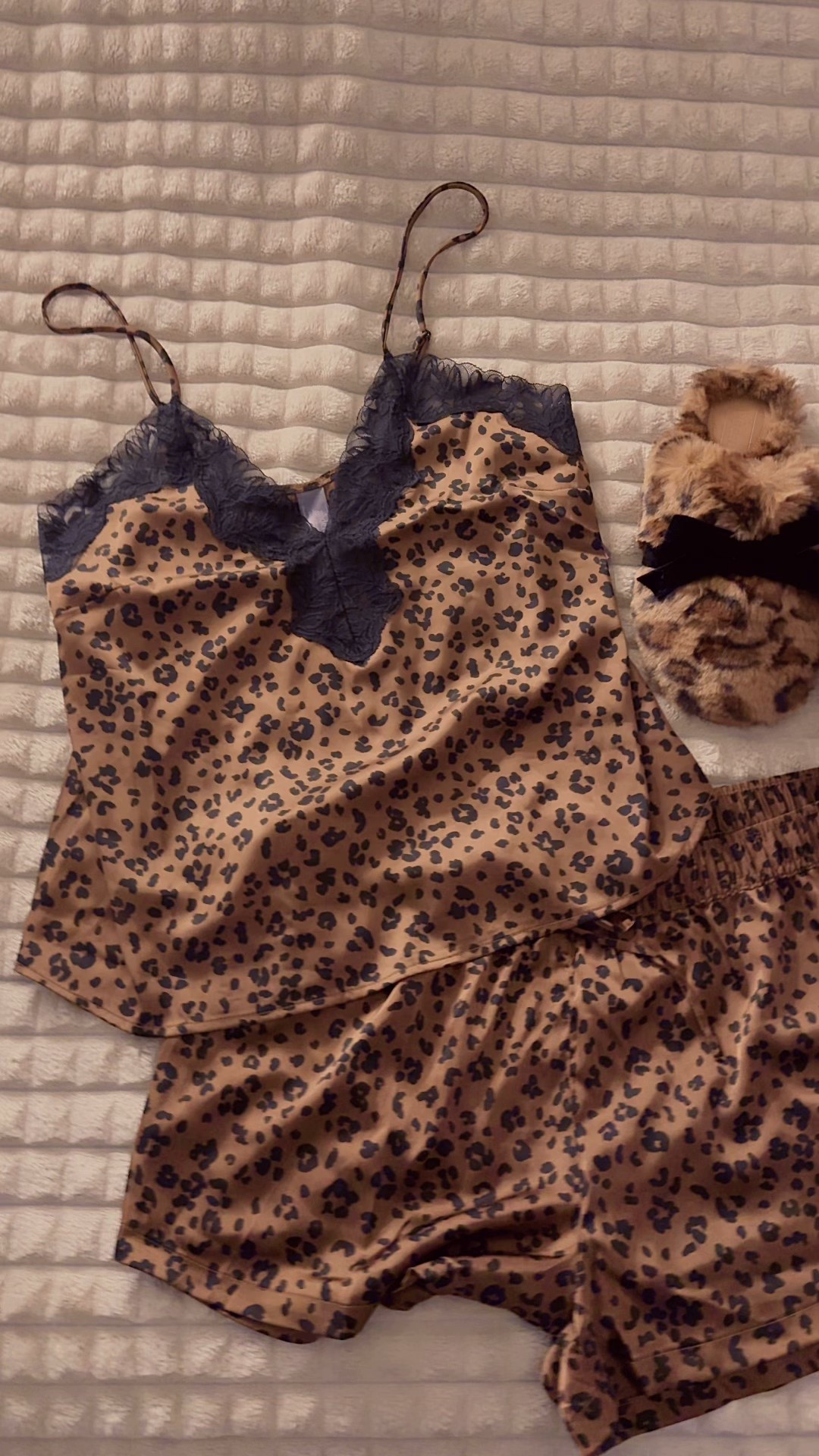 LOVE this pajama set 🐆 it sold real quick only a couple of sizes left. The slippers are still available. I got this in a size large it does fit me a little big but I like the looser fitting. The shorts have a tie strap and you can adjust the top.

#LTKGiftGuide #LTKCyberWeek #LTKootd