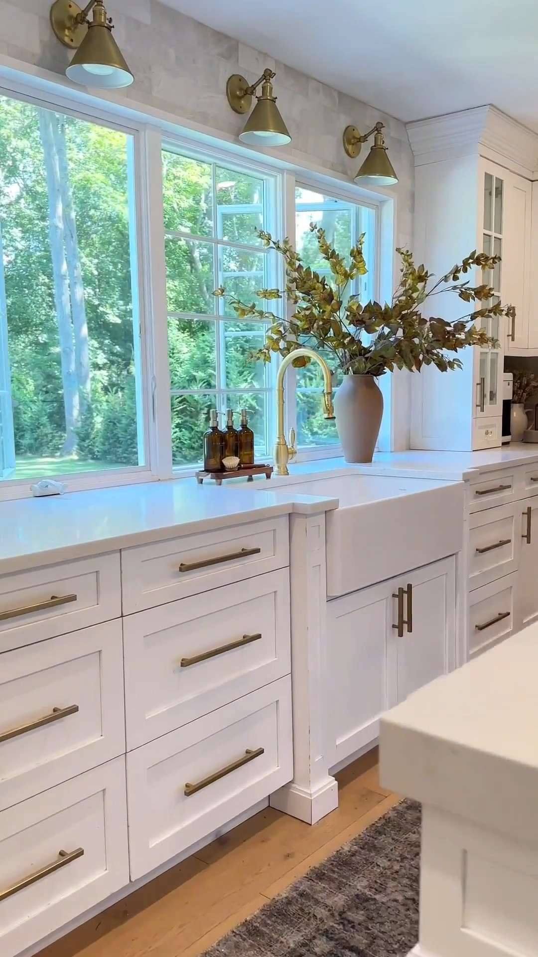 This has been my favorite kitchen view of all time. These artificial grape leaf branches are perfect for fall and year round use with its earthy colors. 

Kitchen decor, sink, faucet, marble backsplash, soap dispensers, area rug runner, sconce lights, brass mills. 



#LTKmorningroutine #LTKSaleAlert #LTKHome