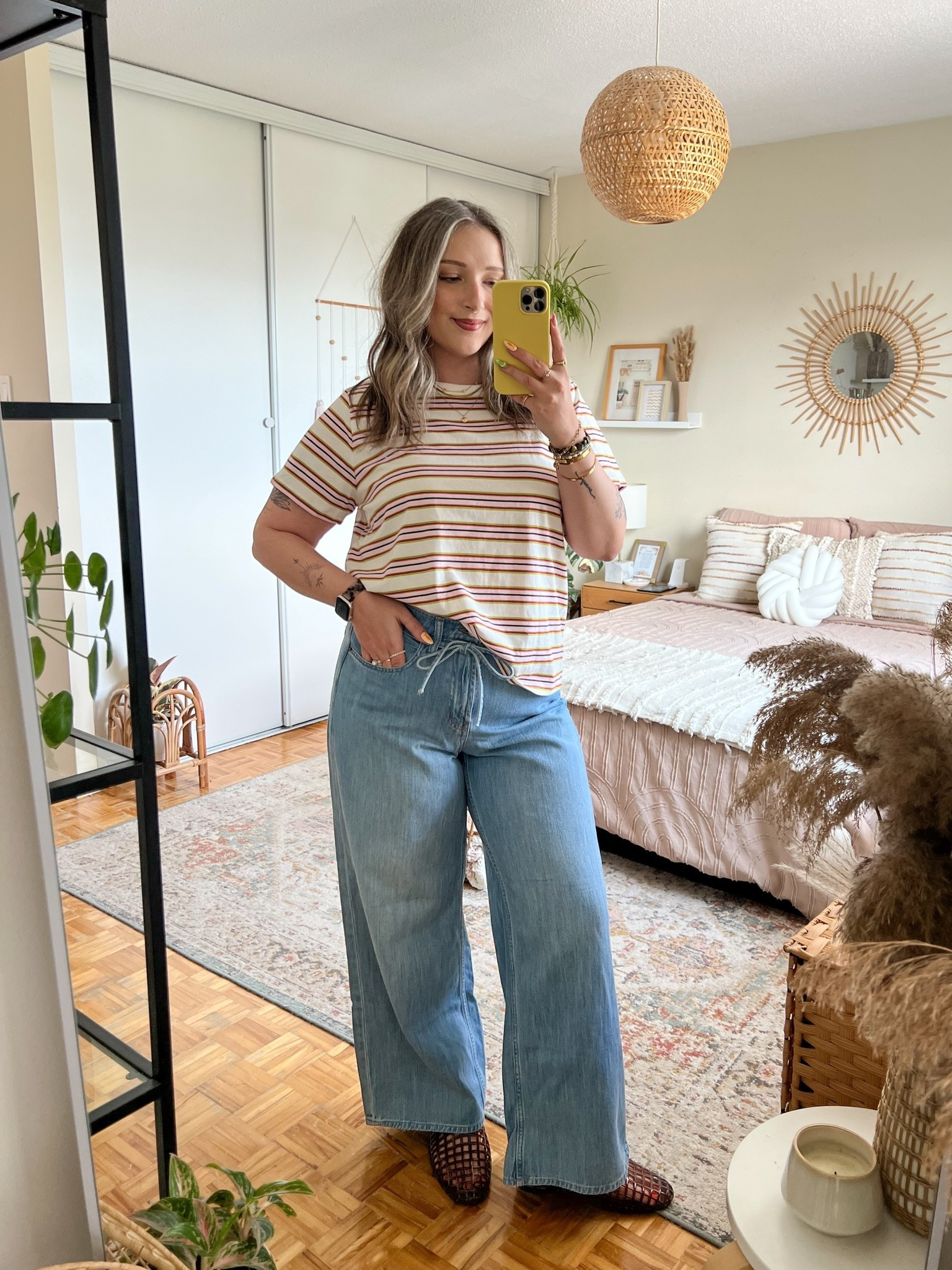 Summer to fall transition outfit! Love the colors of this striped tee & it’s 100% cotton! Sized up to XL for an oversized fit. These wide leg jeans are so flattering with the cutest tie detail (removeable!). I’m wearing my usual size 12. Jelly shoes are also Old Navy, I’m a 9.5-10 and wear a 10. Canadian links under “similar products”

#LTKjeans #LTKsale #LTKmidsize