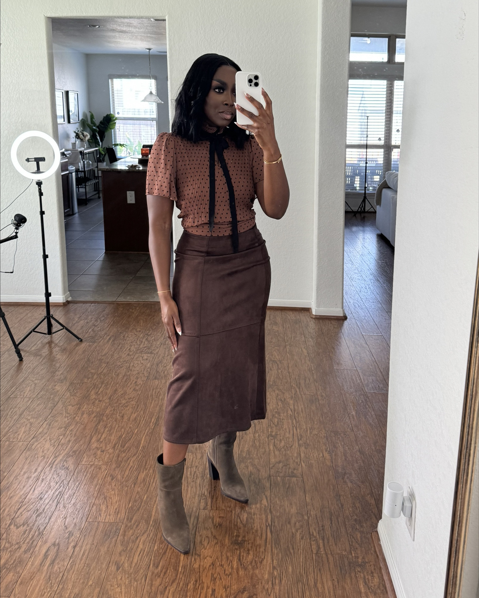 Different shades of brown, and I love how stretchy this suede skirt is! Wearing a small in the top and the skirt. This will be cute for a holiday party or for fall family photos.

#LTKHoliday #LTKFindsUnder100 #LTKStyleTip