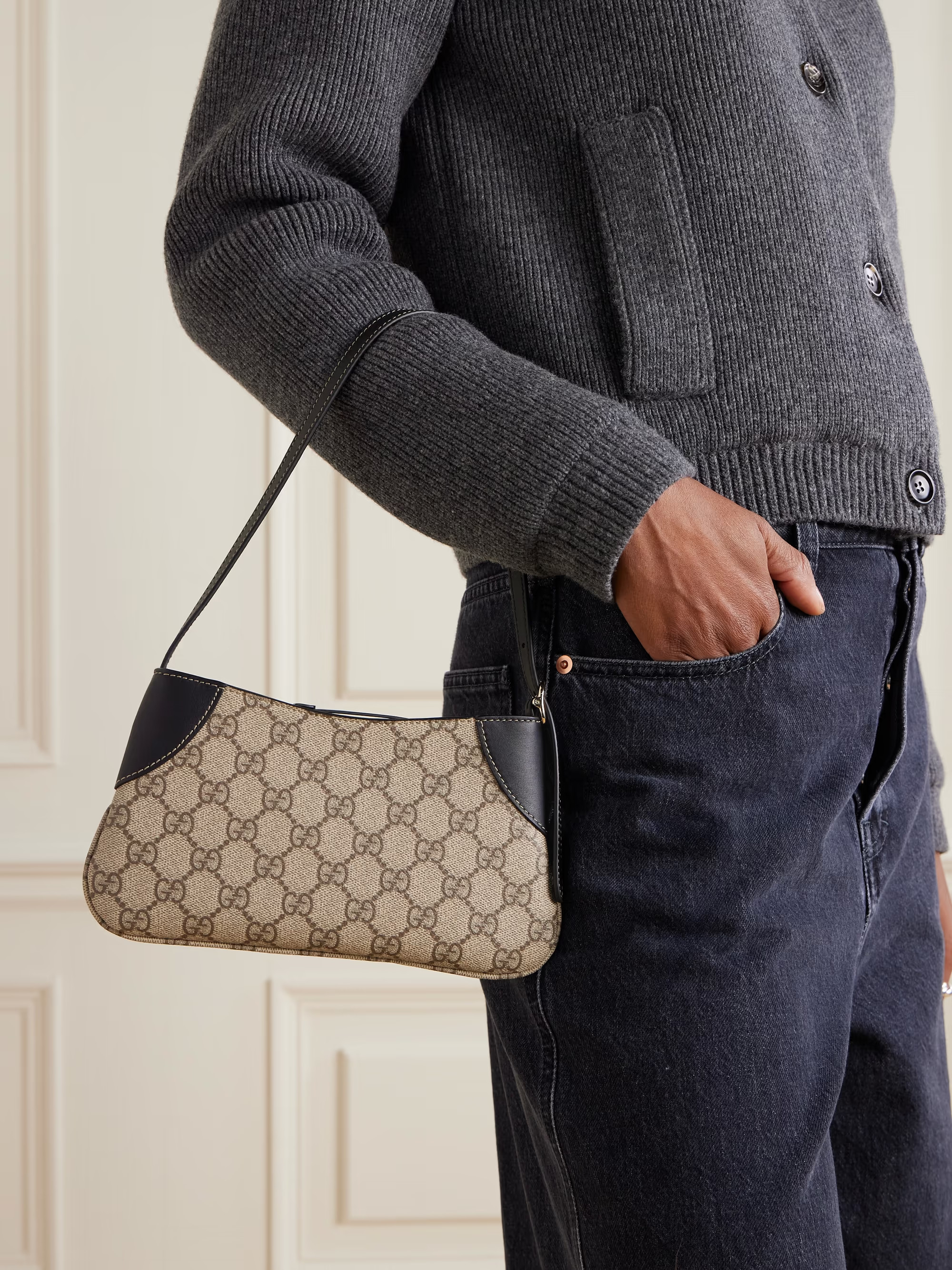 Gucci's bag is made from coated-canvas printed with the iconic logo and traced with solid leather... | NET-A-PORTER (UK & EU)