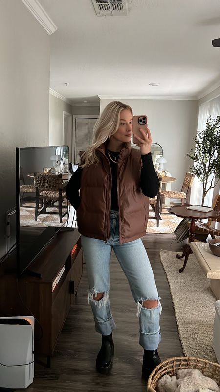 Holiday outfits, holiday fashion, holiday style, winter style, winter outfit, thanksgiving outfit ideas, puffer vest, oversized puffer vest, faux leather puffer vest, brown puffer vest, 90s jeans, winter boots, winter shoes, doc marten boots