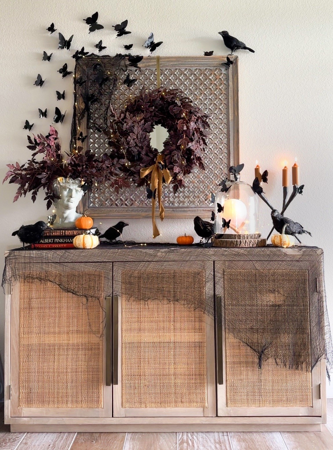 #AD Halloween decor doesn’t have to be spooky to be festive 🖤🎃🌙

I wanted my entryway to feel whimsical and magical without being too scary for my kids and trick-or-treaters. I created this look by layering in dark foliage, mini pumpkins, ravens, candles, 3D butterflies, and of course.. TWINKLE LIGHTS! ✨

I love how the mix of textures, height, and little unexpected details like the butterflies and glowing moon orb make my entryway feel festive without going overboard. 🦋

And the best part? Almost everything is from @Wayfair  with quick shipping! 💜I’ve linked these and similar options so you can easily recreate this look in your own home!

#wayfair #wayfairpartner #halloweendecor #halloween

#LTKHome #LTKSeasonal #LTKSaleAlert