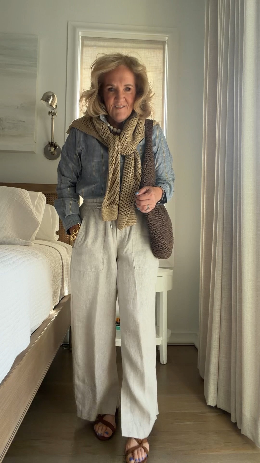 Athleta linen pants are a spring summer must have in this natural color! Wearing a medium petite 
Chambray  blouse with gold metallic stripes size 1. 
Metallic sweater size medium 

#LTKOver40 #LTKPetite #LTKSeasonal