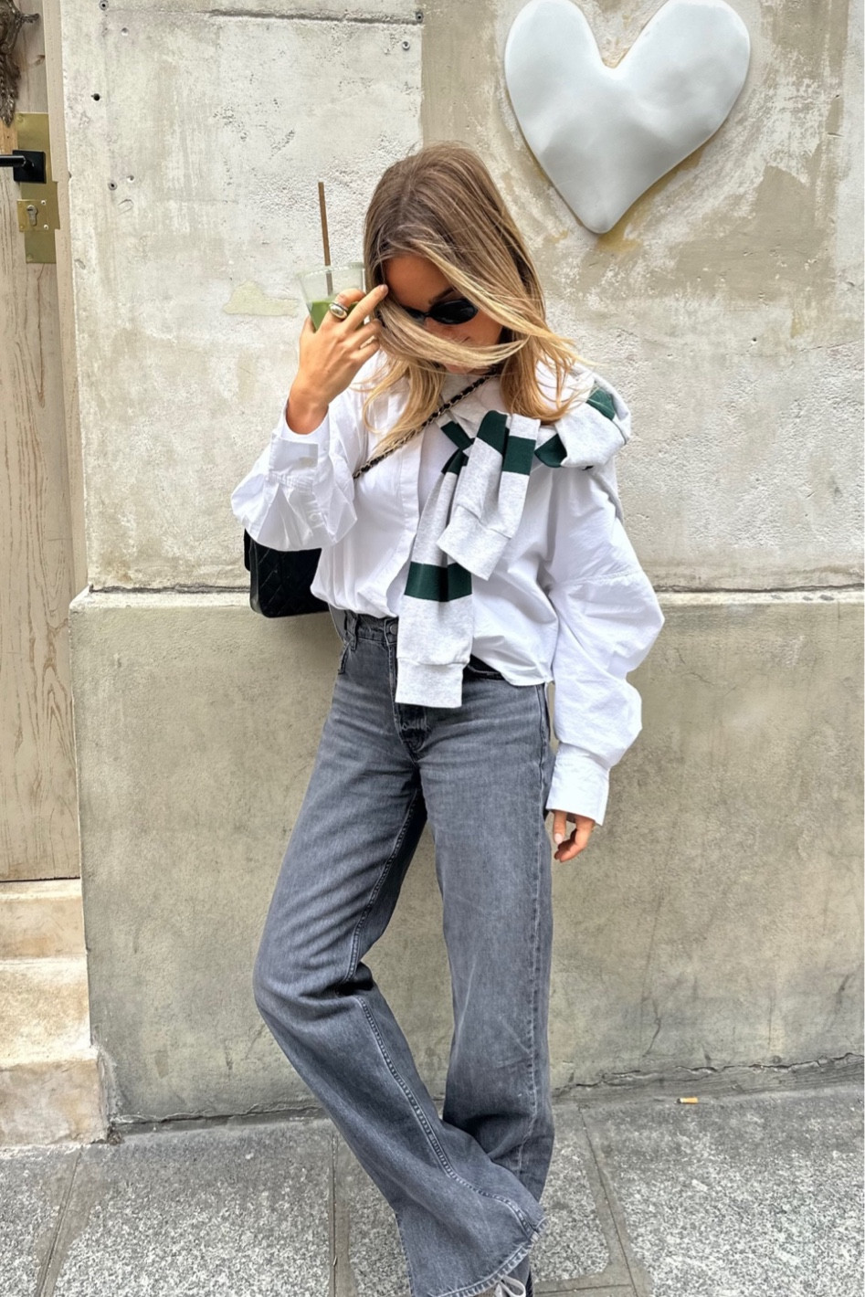 wearing my go-to black jeans in paris 🤍 button down is daily drills!