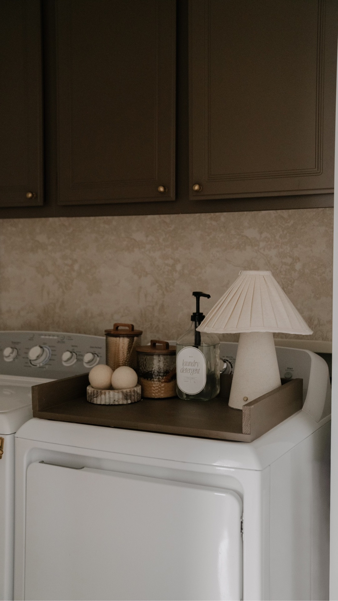 It’s reveal day 🧺✨

I wanted this laundry room to feel calm and actually functional — not just a place we rush through. We kept the palette really soft and neutral, layered in textures, and focused on the little details that make everyday routines feel prettier.

I designed these custom laundry labels to keep everything cohesive (because nothing ruins the vibe like mismatched packaging 🙃) and I listed them on Etsy so you can use them in your own laundry room too.

And one of my favorite little upgrades? I DIY’d the dryer top tray to create a clean folding surface and catch-all moment — it makes the whole space feel more custom and intentional. 

Comment LAUNDRY and I’ll send you the link 🤍

#laundryroomremodel #homerenovation #neutralhome #interiordesigninspo #homedetails laundry room renovation laundry room makeover neutral laundry room modern laundry room beige home aesthetic custom cabinetry beadboard walls brass hardware built in storage home refresh interior styling cozy functional spaces before and after home home improvement project elevated utility spaces

#LTKHome
