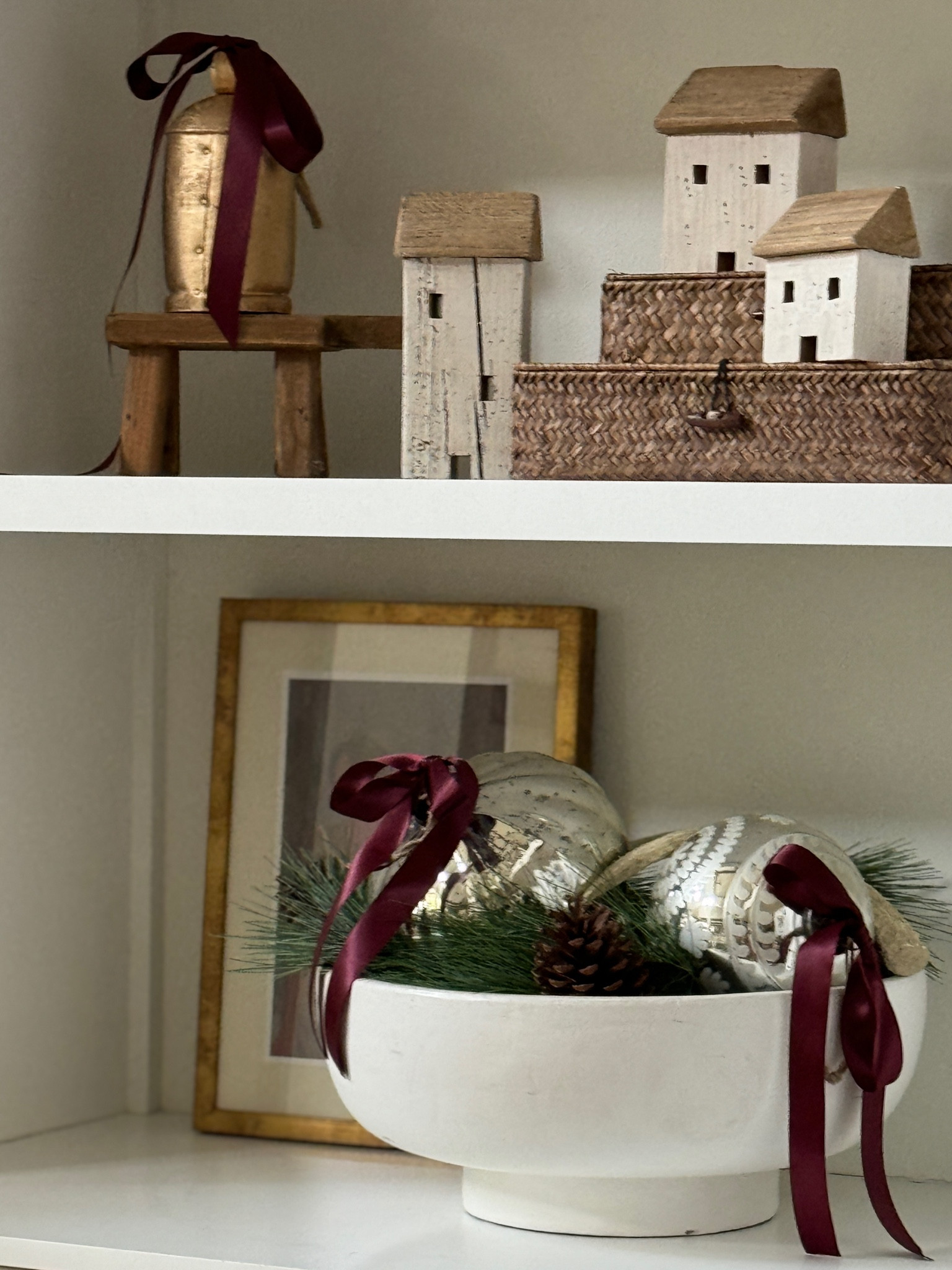 Holiday shelfie for the season! Large bowls, ornament, holiday cottages, ribbons and bells are all you need!

#LTKHome #LTKHoliday #LTKSeasonal