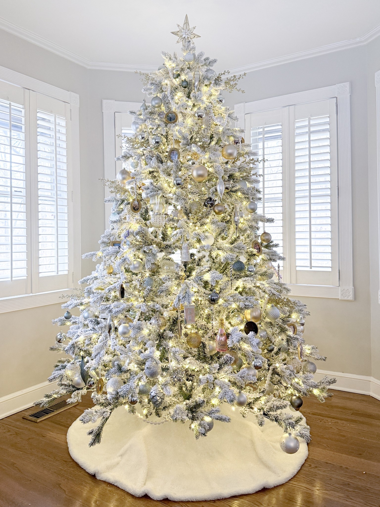 Glitter & gold metallic flocked Christmas tree. This Rushmore flock tree is so easy to set up, and works so beautifully in this space which is pretty wide, but only has 8’ ceilings. I also love the large than usualspacing between the branches which allows plenty of room for all of your ornaments to really shine. 

#LTKSeasonal #LTKHoliday #LTKHome