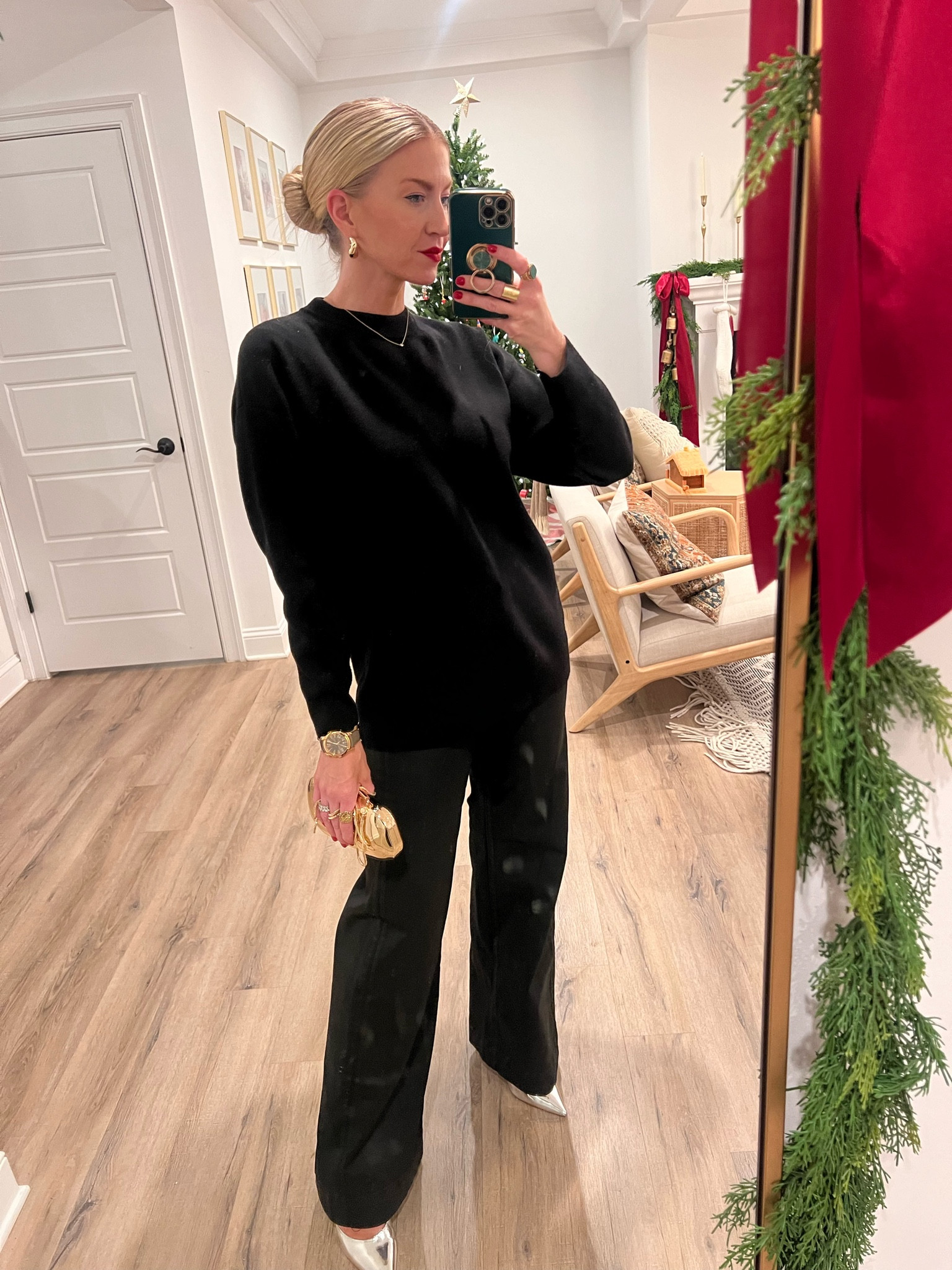 All black look. Black sweater with leather coated jeans, gold chrome clutch and metallic silver heels  

#LTKparties #LTKshoecrush #LTKstyletip