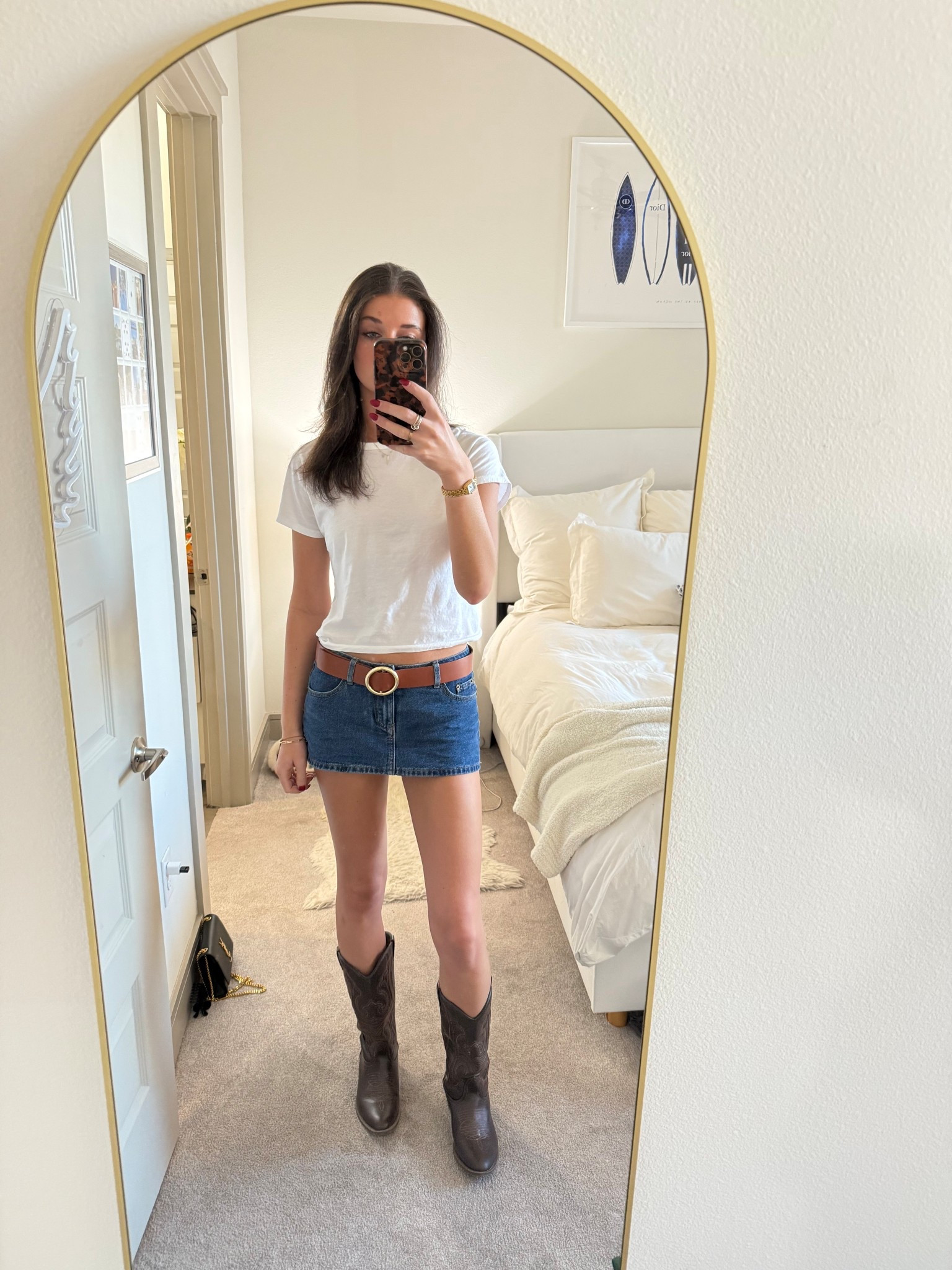 Low rise Denim mini skirt. Brown belt. Abercrombie white tee. Brown cowboy boots. Edikted. Gameday outfit. Outfit inspiration.

#LTKTravel #LTKFindsUnder100 #LTKootd