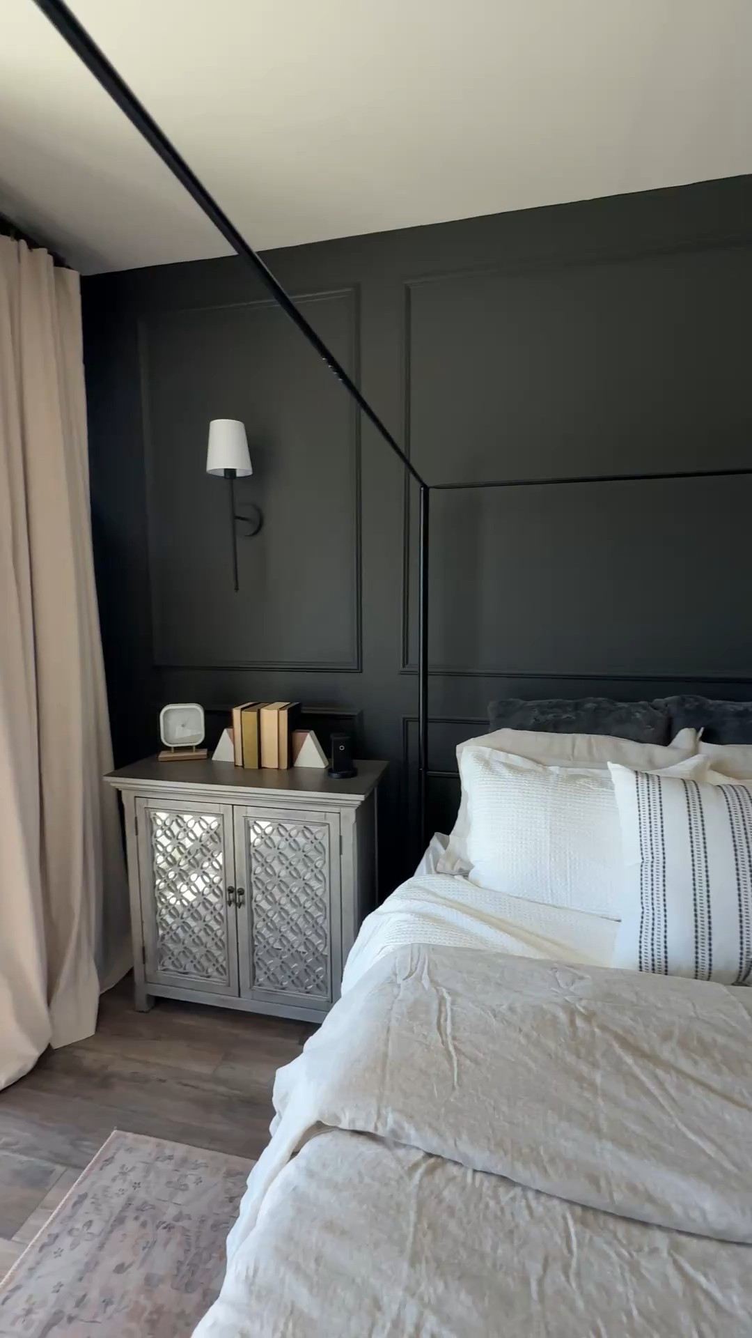 This canopy bed frame is the showstopper in our bedroom 