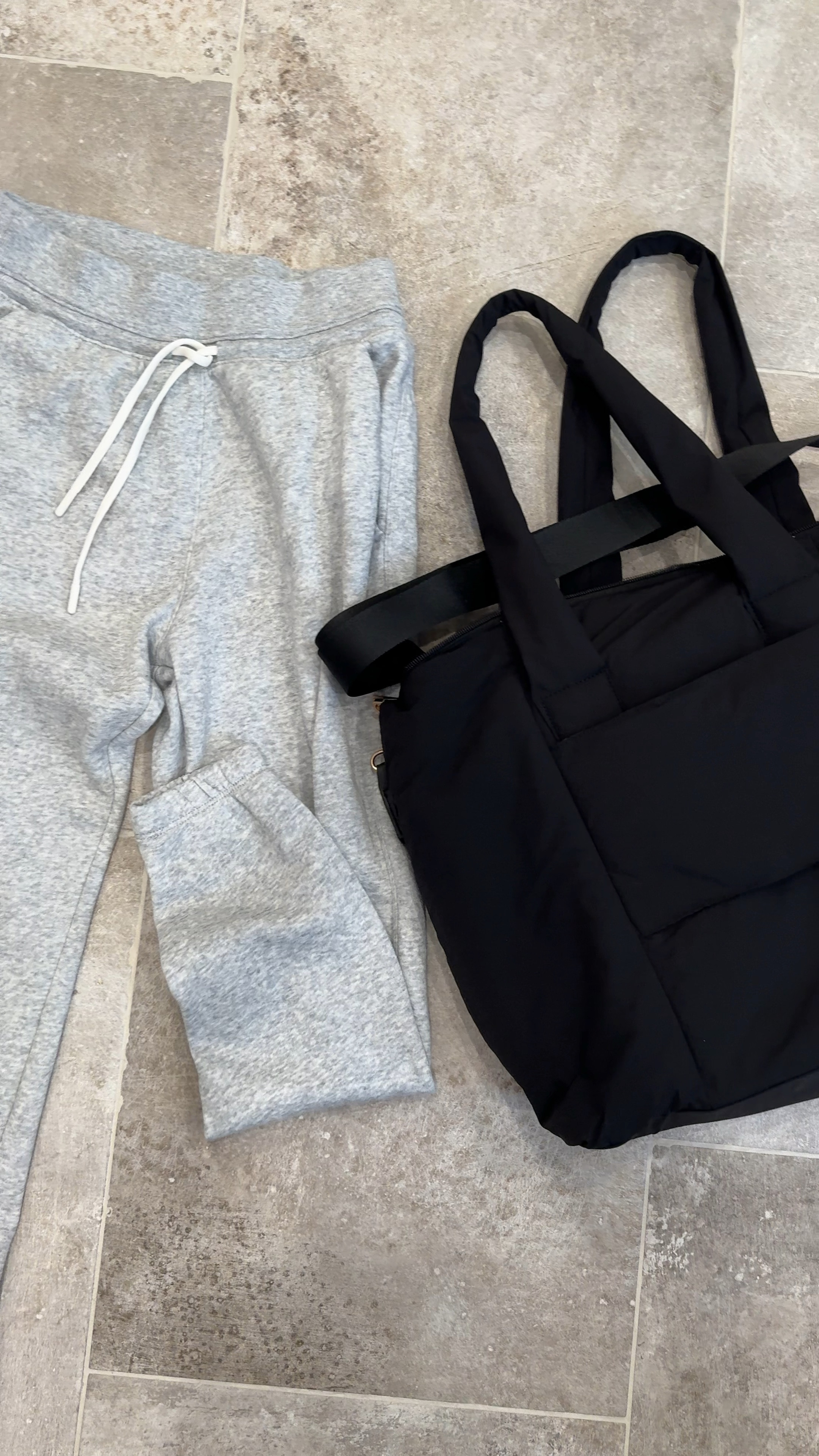 my two favorite pieces from traveling this weekend- this lounge set was SO COMFY but also cute. didn’t look slouchy at all. i’m 5’ and these pants fit perfectly. looked cute w slip ons and tennis shoes. my bag is washable 🙌🏻 and held SO MUCH STUFF! i love that it slipped over my luggage handle to easily carry 

#LTKTravel #LTKSeasonal #LTKBeauty