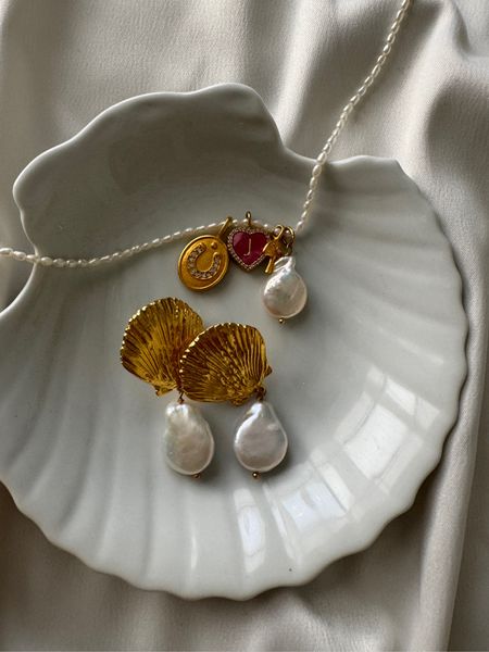 Charm necklaces and chunky gold earrings with a vintage feel will be on repeat this Spring and summer. I am obsessed with this seashell inspired pair of statement earrings, you can dress them up for a wedding or down for everyday! They also would make the perfect Mother’s Day gift! 🐚

#LTKstyletip #LTKGiftGuide #LTKwedding