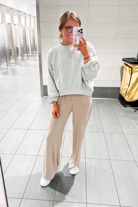 Travel day outfit, comfy travel outfit, airport outfit, grey cropped sweatshirt, tan lounge pants, neutral travel outfit, white Nike sneakers, chunky neutral sneakers  

#LTKStyleTip #LTKTravel #LTKSeasonal