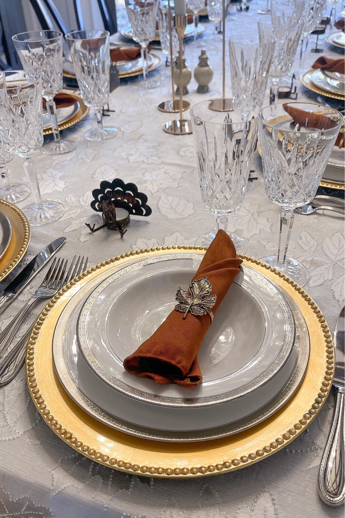 Thanksgiving table setting with our wedding china. Most items from Amazon. Simple classic elegant easy Thanksgiving setup decor fall autumn home decor white tablecloth brown napkins turkey candle holders leaf napkin rings fine china

#LTKhome #LTKfindsunder50 #LTKHoliday