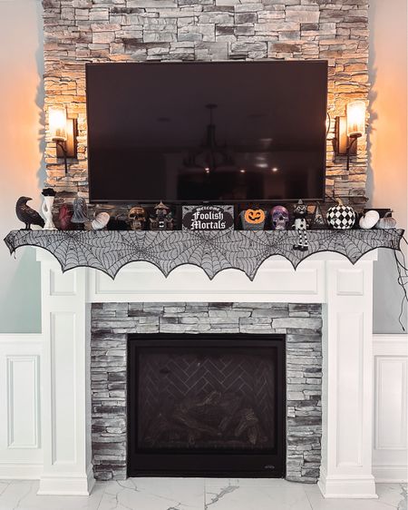 Halloween mantle in the living room. This is one of my favorite places in our home to decorate for the season. Also a big gathering area during our Halloween party. 

#LTKhome #LTKHalloween #LTKparties