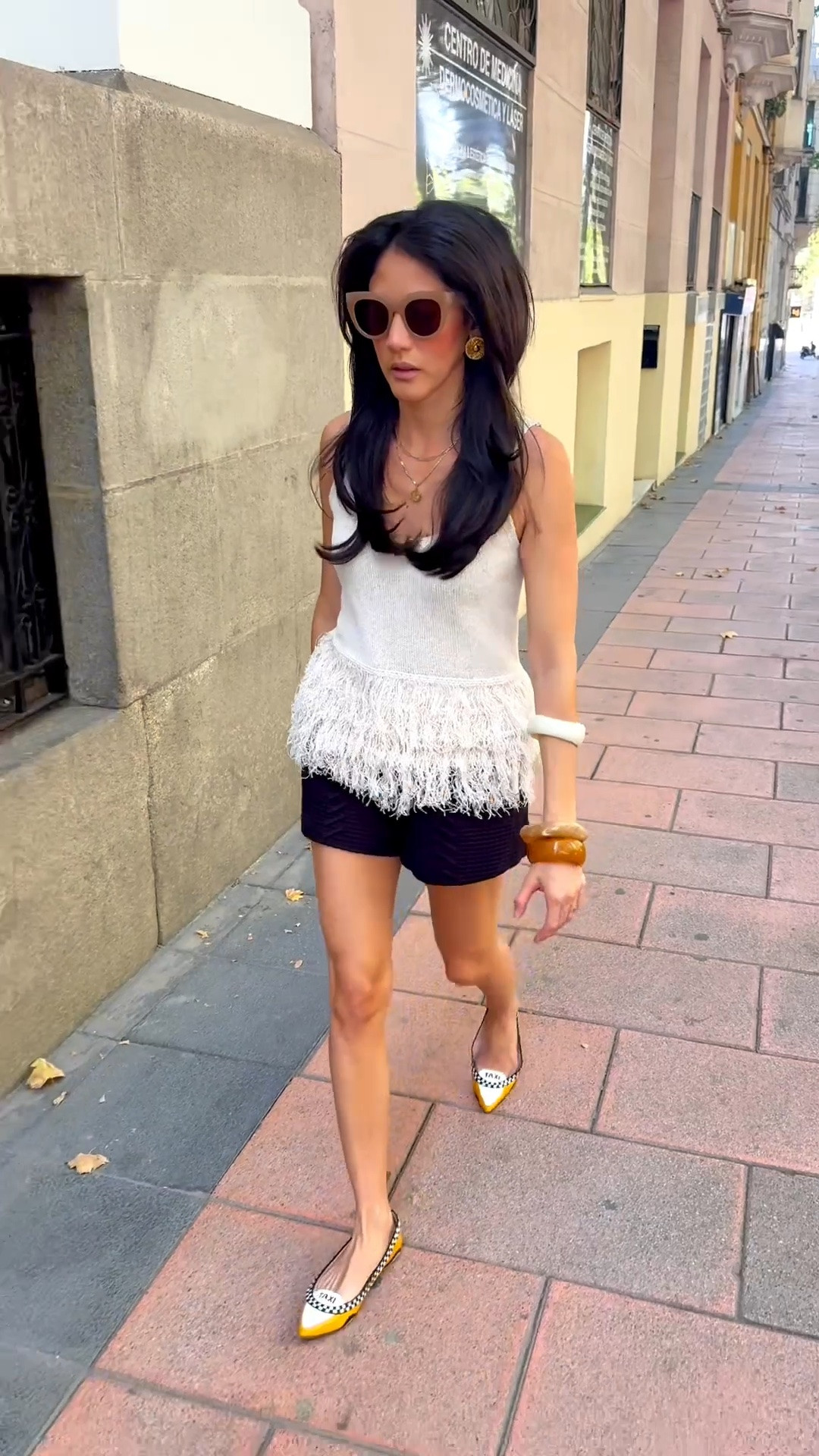 Sunday afternoon outfit: Fringe top, casual but sophisticated shorts, neutral bangles, statement stud earrings.

#LTKTravel #LTKootd #LTKPetite