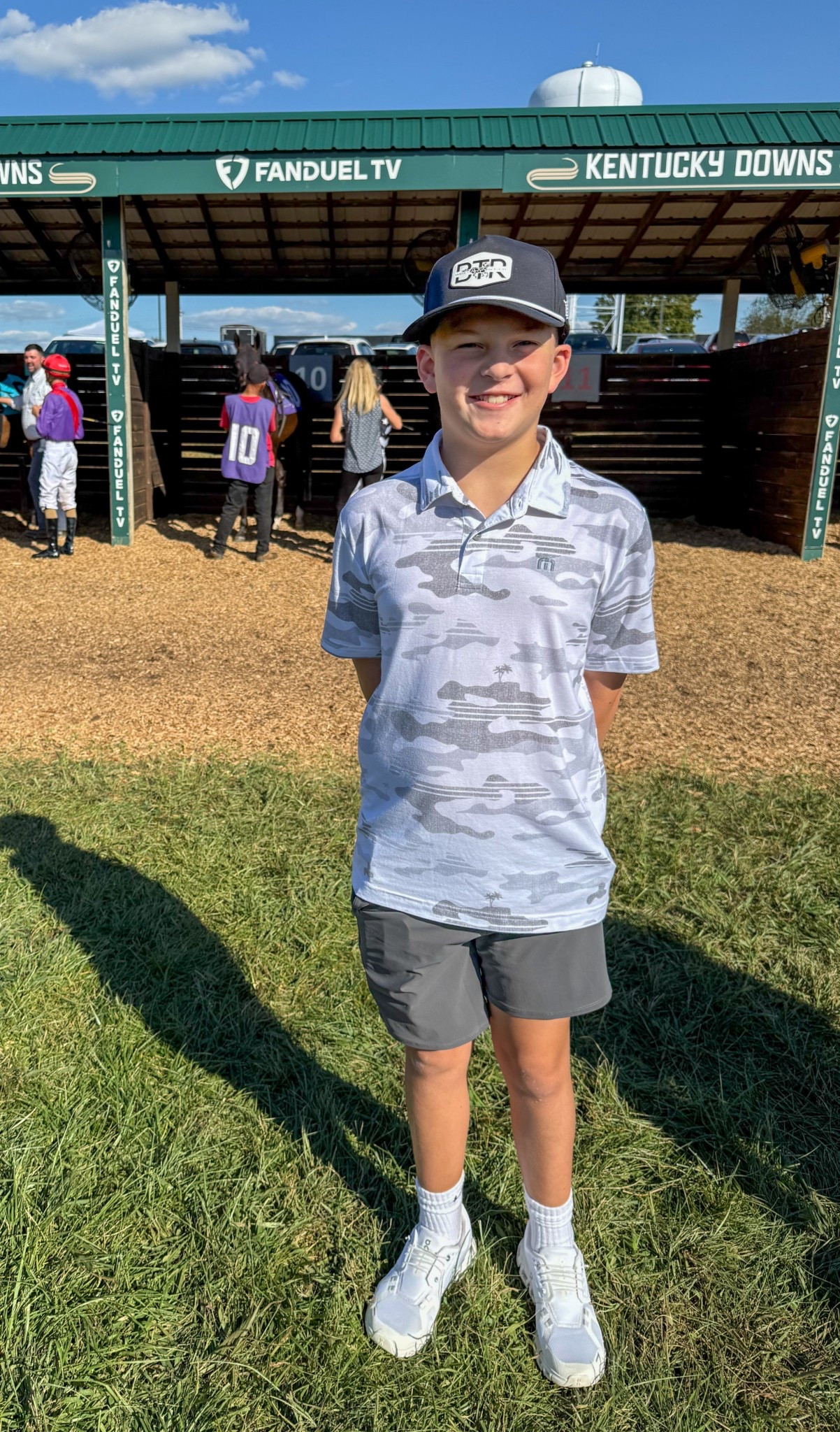 An amazing day at Kentucky Downs.  Our family explored the venue, cheered on the races, enjoyed the concessions, and best of all—left on an absolute high after winning our horse race! #KentuckyDowns #FamilyDay #HorseRacingLife #RaceDayVibes #FamilyAdventures #WinningMoment

Outfit Details:
	•	Son’s look: white and gray camo print golf polo, black athletic shorts, white sneakers, worn with a black backwards cap — casual, comfortable, and cool for a full day outdoors.

#MensCasualStyle #BoysCasualStyle #FamilyTravelStyle #RaceDayFashion #LTKfamily #LTKmens #LTKkids #LTKstyle #LikeToKnowIt

#LTKMens #LTKFamily #LTKKids