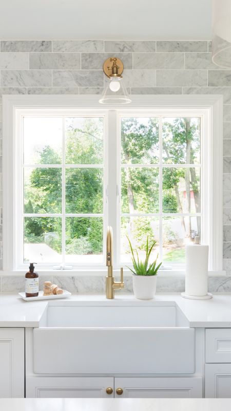 Bright white coastal style kitchen with brass fixtures and white cabinets, kitchen accessories

#LTKfamily #LTKhome