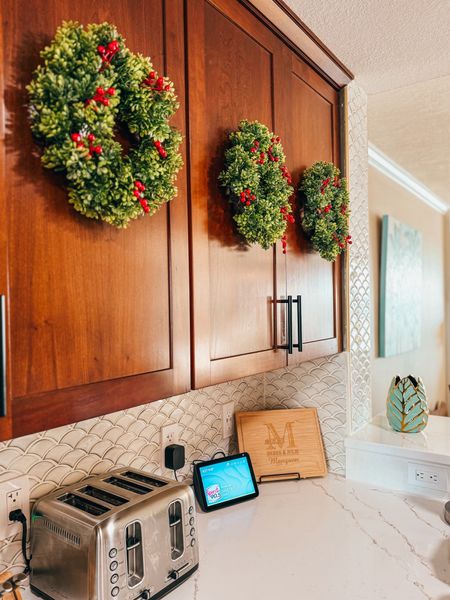 This year I added Mini Boxwood wreaths with berries to our kitchen cabinets. I used small Command hooks so I wouldn’t damage the cabinets and can remove after Christmas! 

I love the way they look 🎄

#LTKhome #LTKHoliday #LTKSeasonal