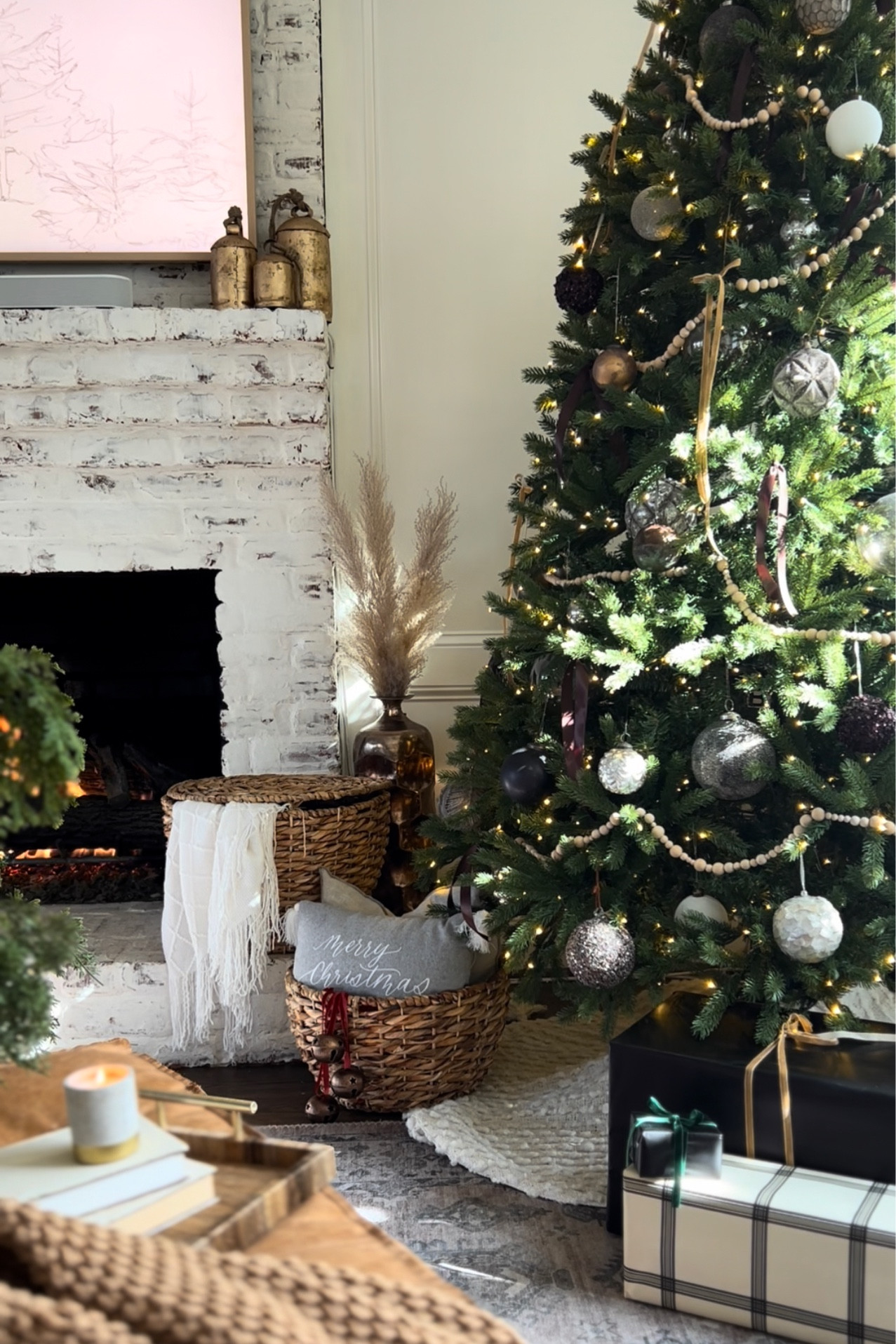 Christmas decor this year! Loving this cozy view 🤍

Brown ribbon / velvet ribbon / blankets / baskets / gold bells / wooden garland

#LTKSeasonal #LTKhome #LTKHoliday