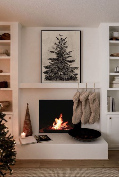 Holiday mantel decor 🌲

#christmas #homedecor #stockings #fireplace #artprint 

#LTKCyberWeek #LTKHoliday #LTKSeasonal