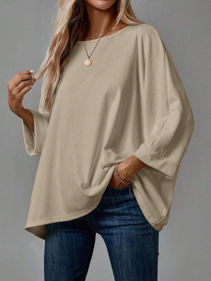 This oversized top is perfect for effortless summer business casual looks. The batwing sleeves and soft neutral color make it a relaxed staple you can dress up or down with ease.

#LTKSummerEdit #LTKU #LTKSeasonal