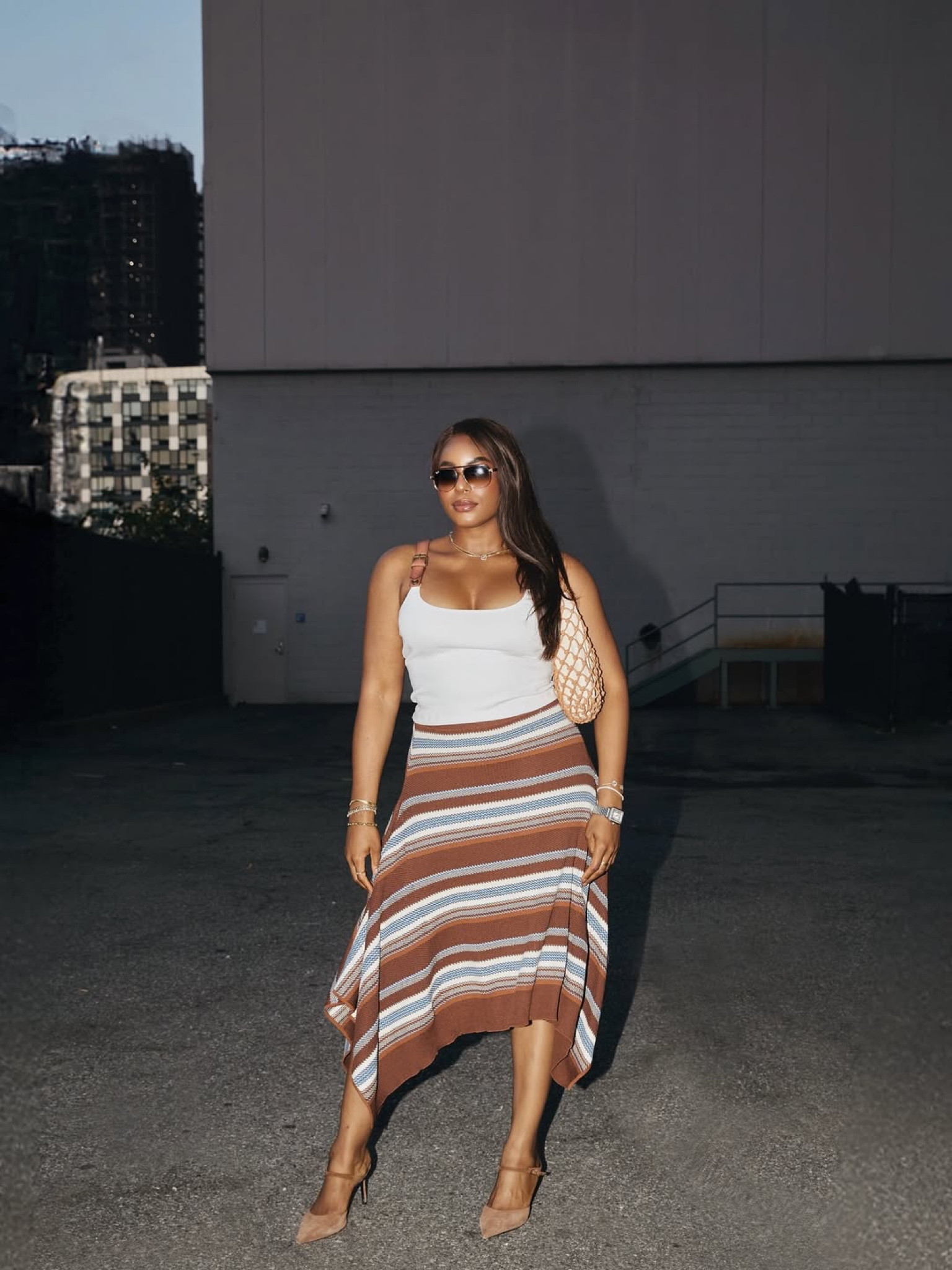 Stepping out in the cutest pre fall outfit for monse during NYFW! Wearing a buckle strap white tank top, striped knit asymmetrical skirt, suede heels, and staud net handbag / linking this fall outfit below … For more links to skinny jeans, wedding guest dress, fall wedding guest dress, fall outfits, sisterstudio, canvas barn jacket, fall family photo outfits, halloween decor, country concert outfits, wedding guest, follow me on LTK! ✨


#LTKFallSale #LTKSeasonal #LTKStyleTip