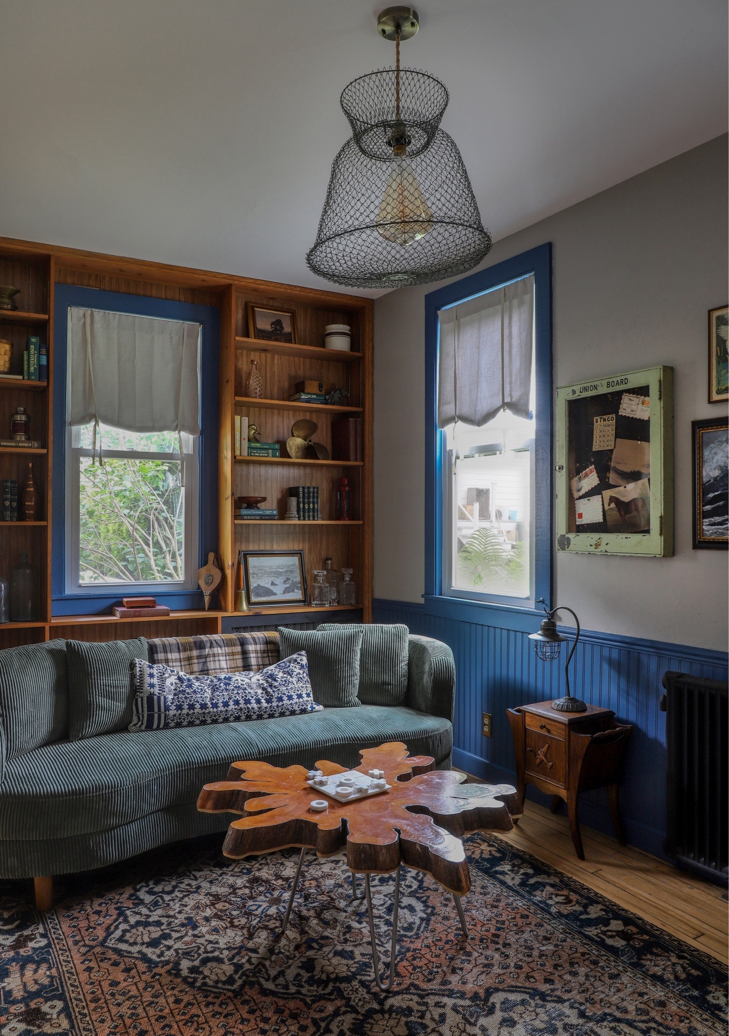 Shop the Coachhouse living room. This stunning green couch is a showstopper. Read about the full room makeover on ispydiy.com. 

#roommakeover #livingroommakeover 

#LTKCyberWeek #LTKhome
