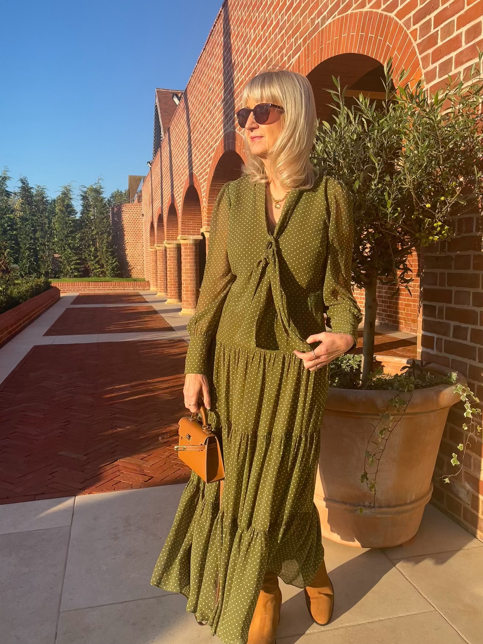 Autumn Outfit
A beautiful sage green polka dot tiered midi dress with tan accessories 

#LTKluxury #LTKautumn #LTKeurope