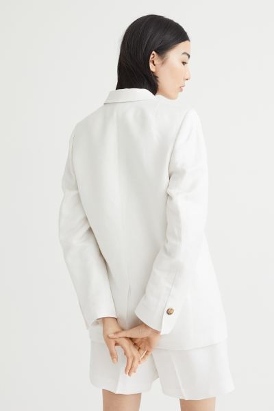 Single-breasted jacket in a woven viscose blend with notch lapels and a two-button fastening at t... | H&M (UK, MY, IN, SG, PH, TW, HK)