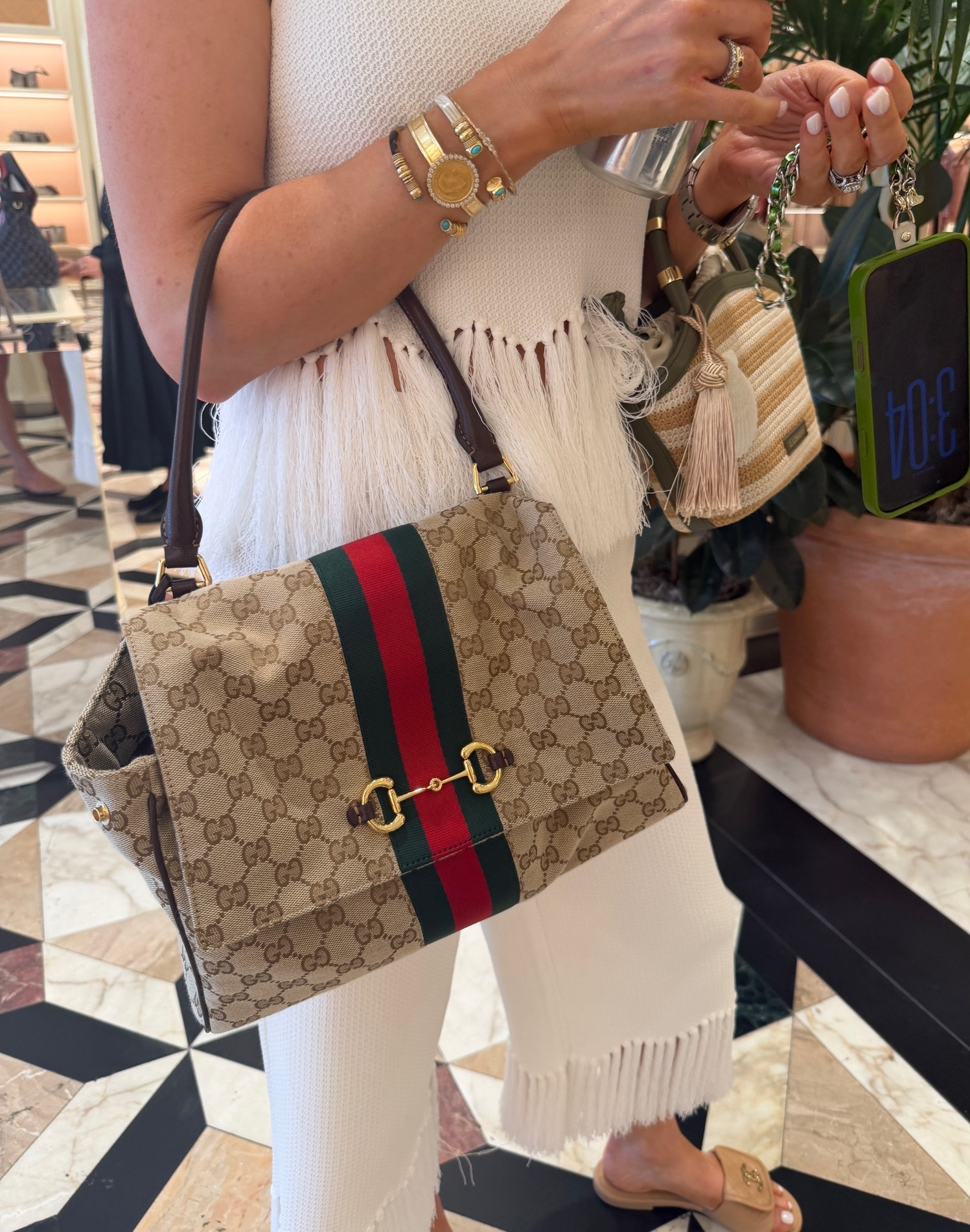This is the medium version. I loved the functionality and the print with the classic Gucci stripe. It’s slouchy yet a bit structured. I think I’m gonna get this one.

#LTKTall #LTKTravel