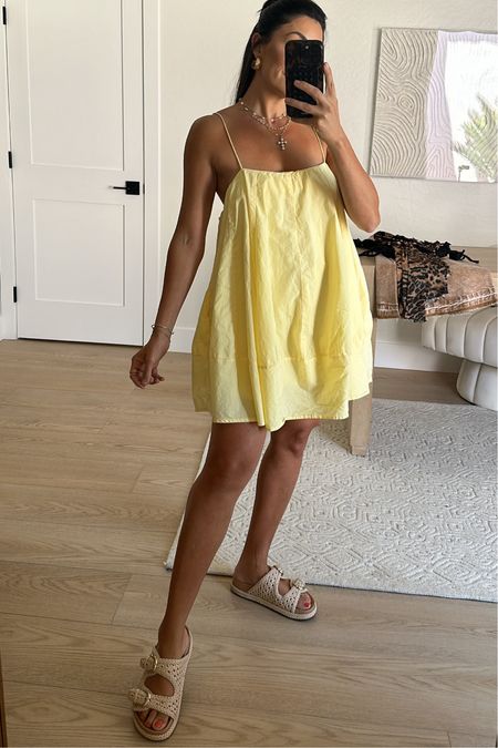 Forever wearing this free people dress!! Reina has her preschool graduation later today and I thought it would be perfect so she could spot me in the crowd! Wearing a size XS

Yellow dress
Rattan slides 
Mini dress 

#LTKStyleTip #LTKSeasonal #LTKTravel