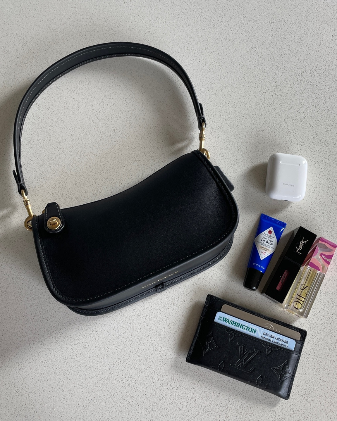 What’s in my bag 🖤 I am OBSESSED with this tiny purse, it is perfect — small but still fits a phone, leather, high quality, minimal but not too basic — I’m in love. Coach is really making a comeback and I’m here for it 🙌🏼

#LTKstyletip #LTKparties #LTKitbag